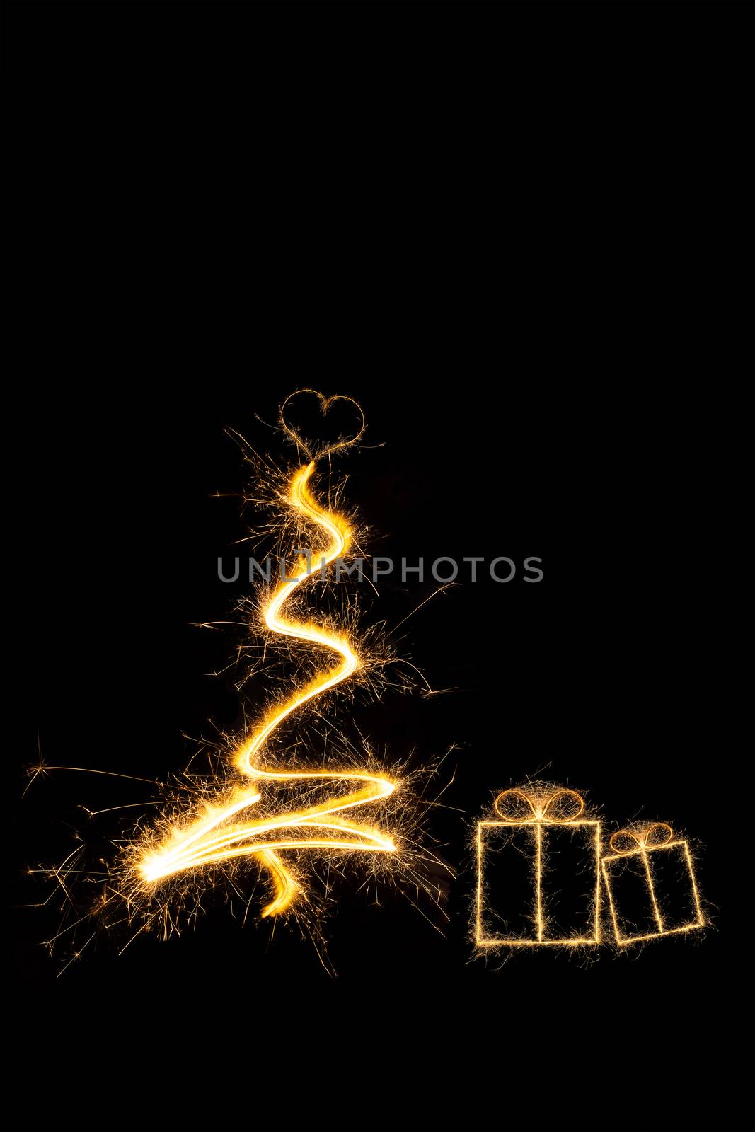 Sparkling abstract christmas tree and gifts isolated on black background. Contemporary minimal style christmas card.