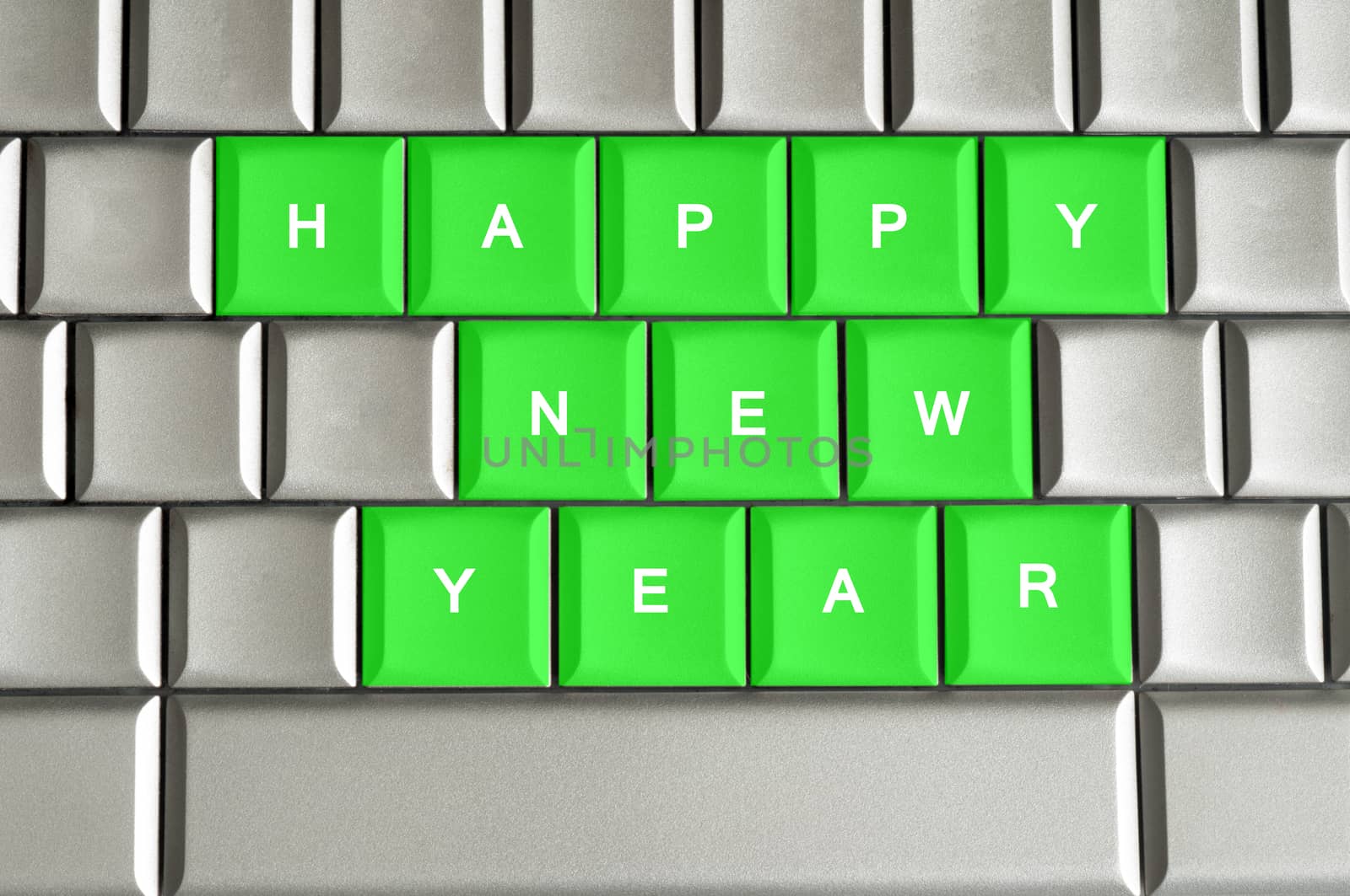 Happy New Year spelled on a silver metallic keyboard