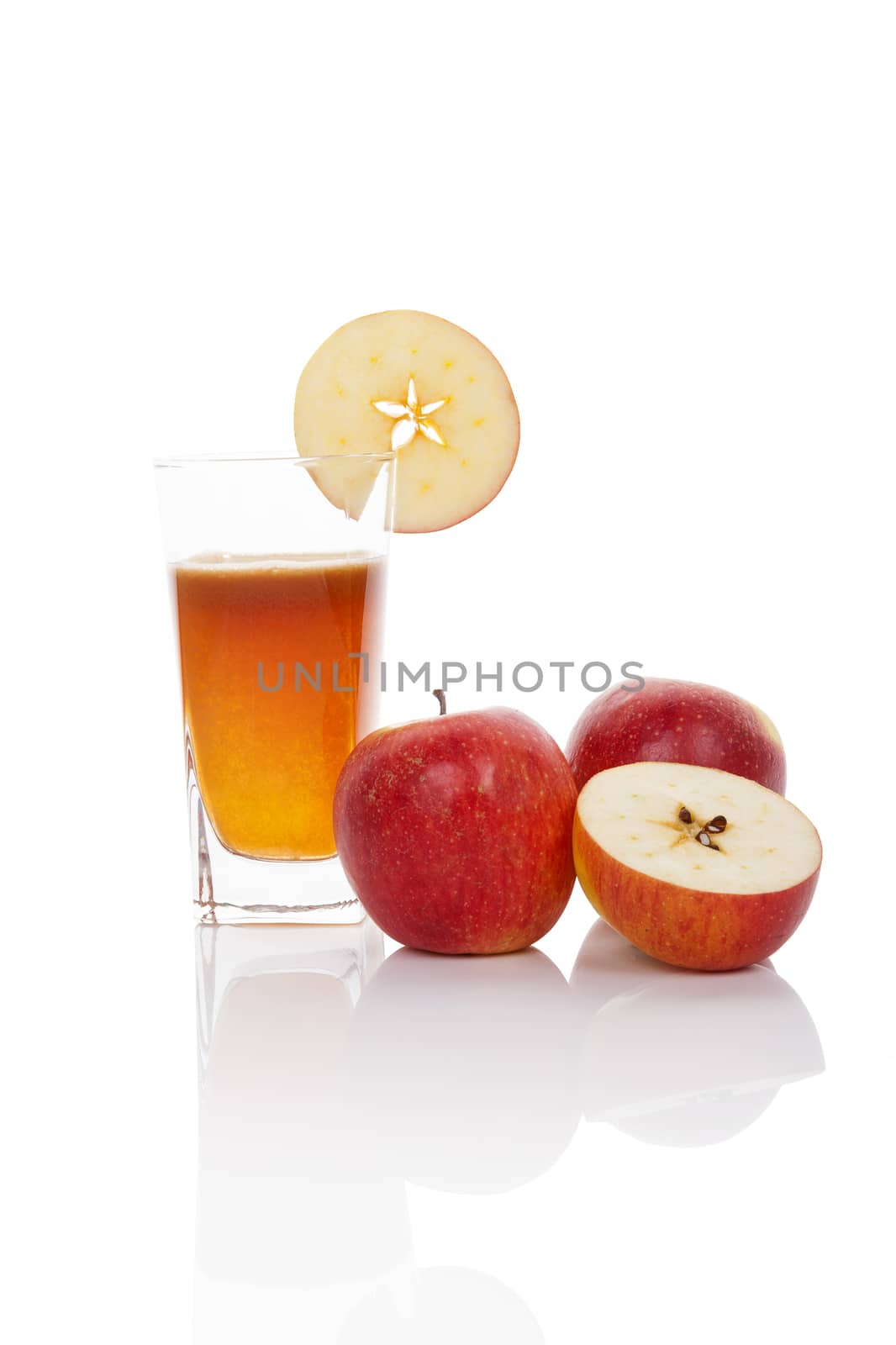 Fresh apple juice with fresh red ripe apple isolated on white background with reflection. Healthy fresh summer drinking.