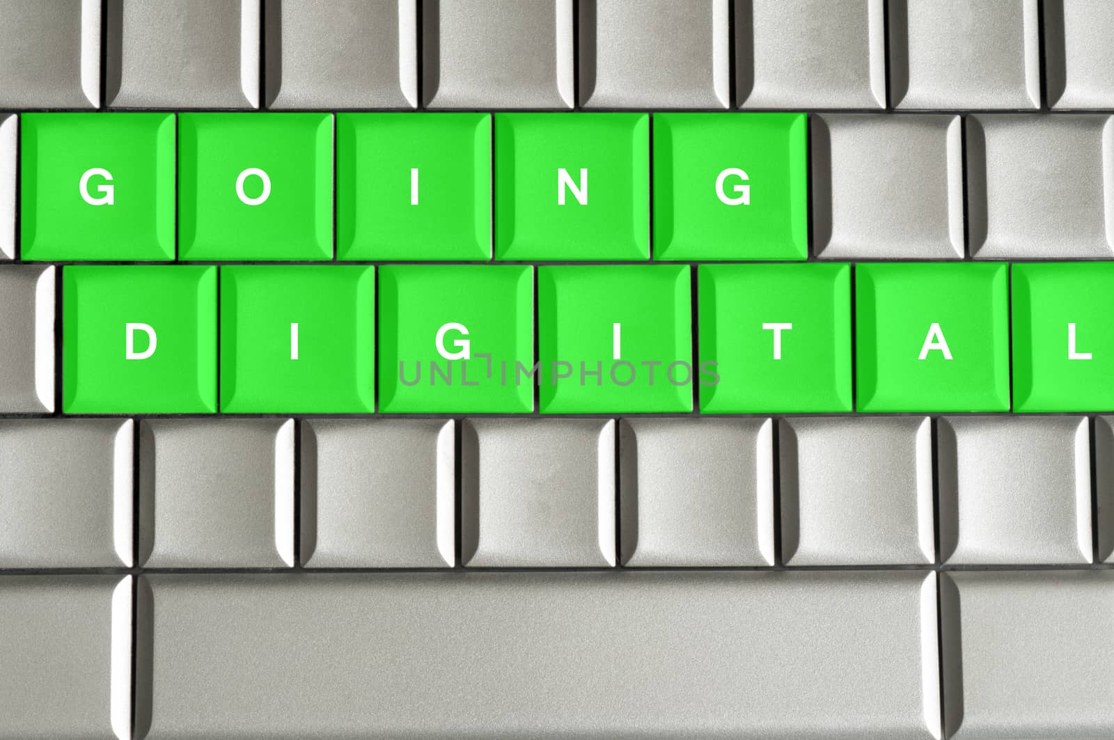 Going Digital spelled on a silver metallic keyboard