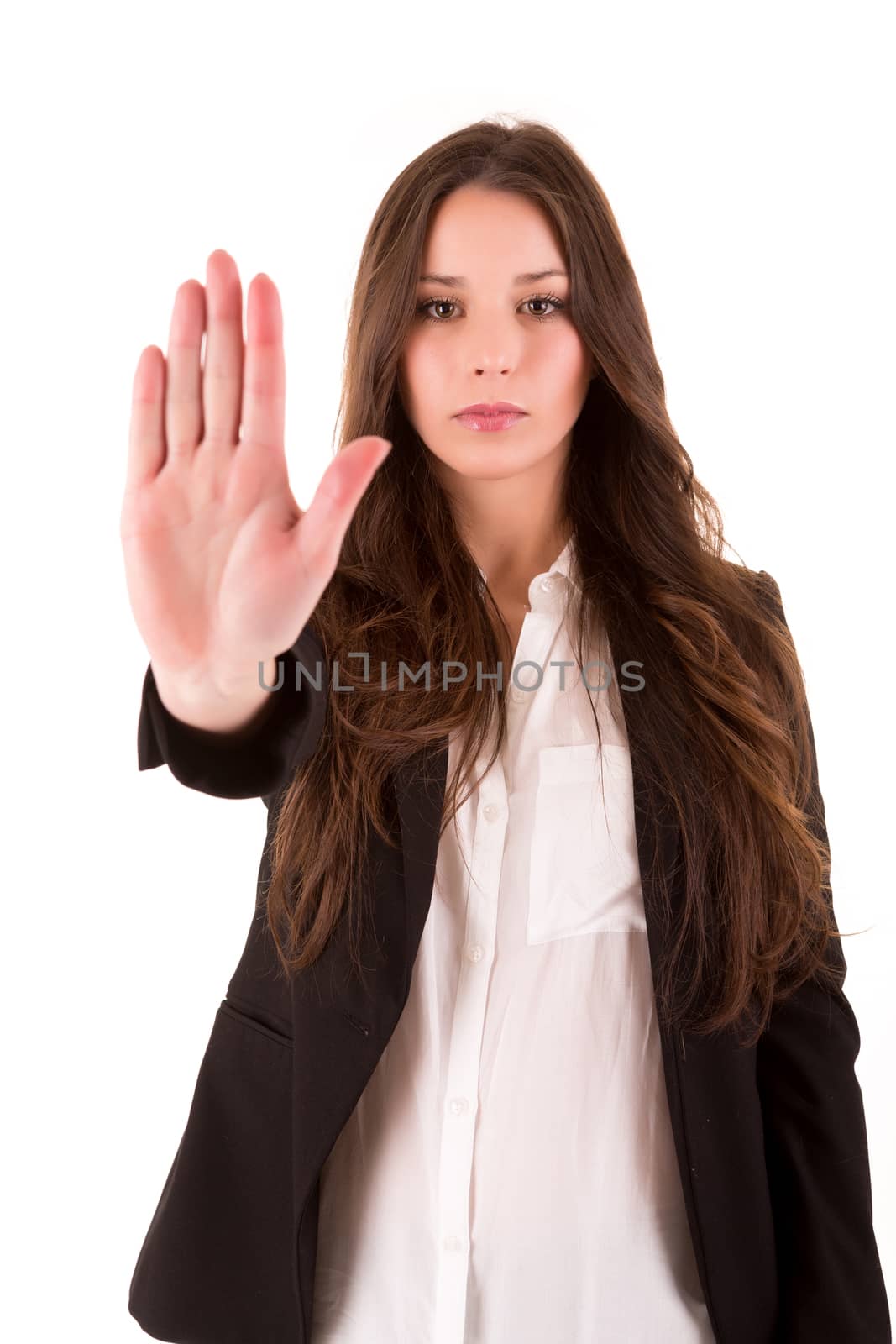 Smiling woman doing STOP sign over white background