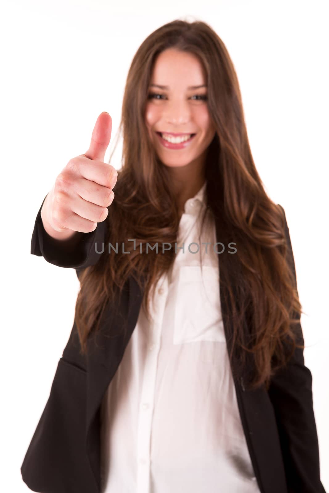 Smiling woman giving thumbs up - selective focus on hand