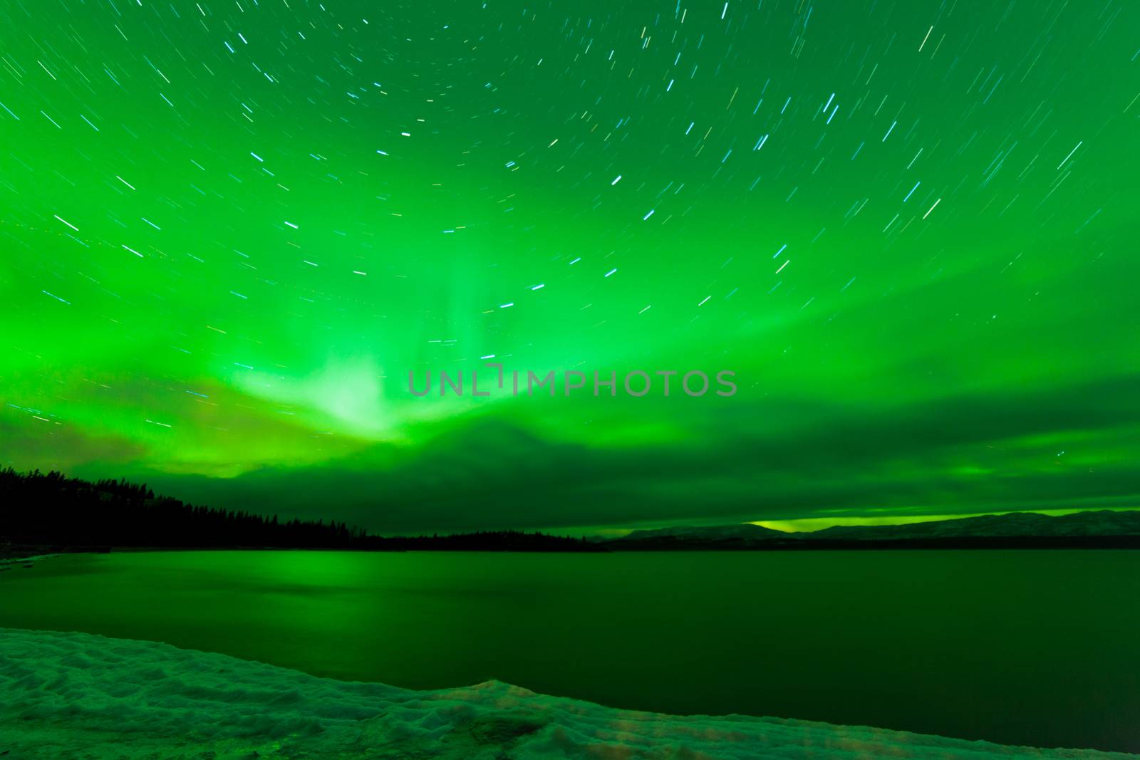 Aurora borealis starry night sky over Lake Laberge by PiLens