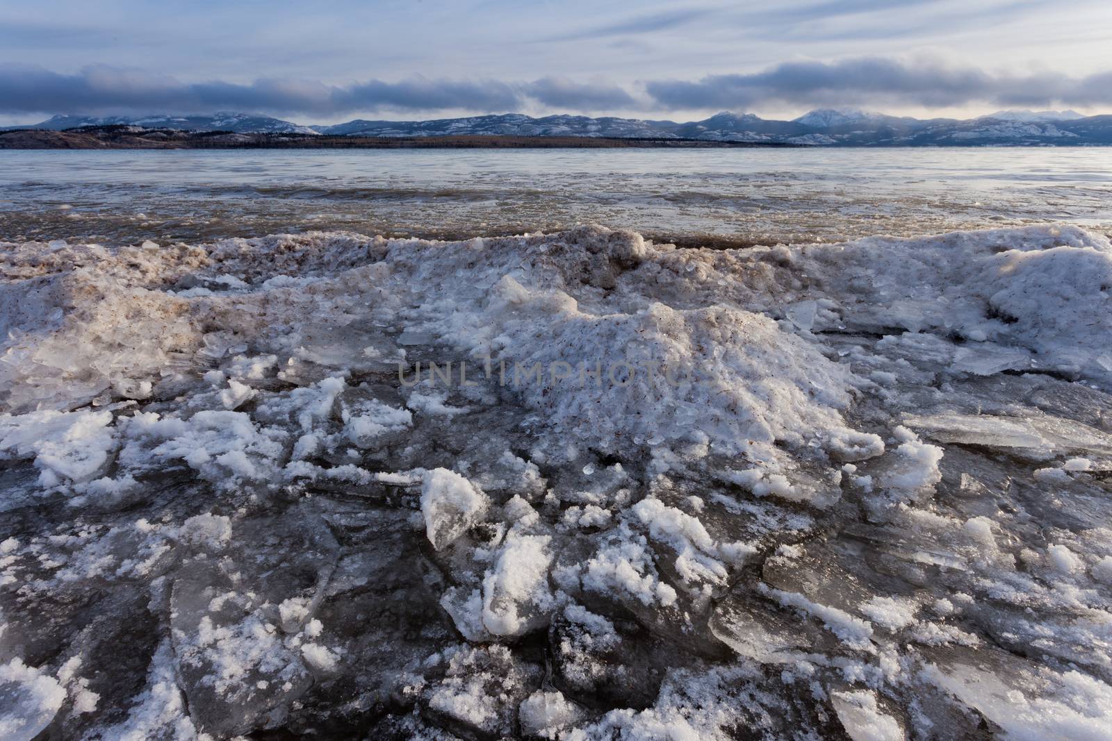 Shore ice piling up Lage Laberge Yukon Canada by PiLens