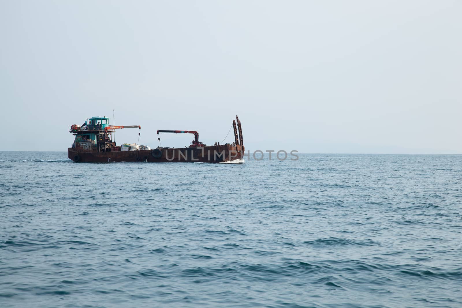 large cargo ship. Was sailing in the sea. To Delivery to the island.