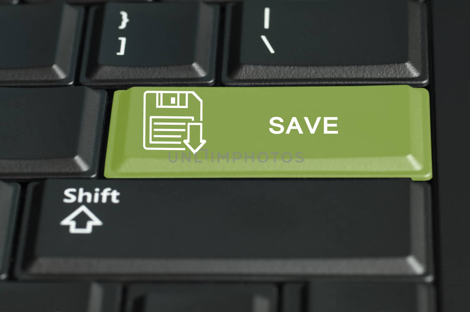 Concept of save  action . The focus is on the enter key with the shift button on the bottom