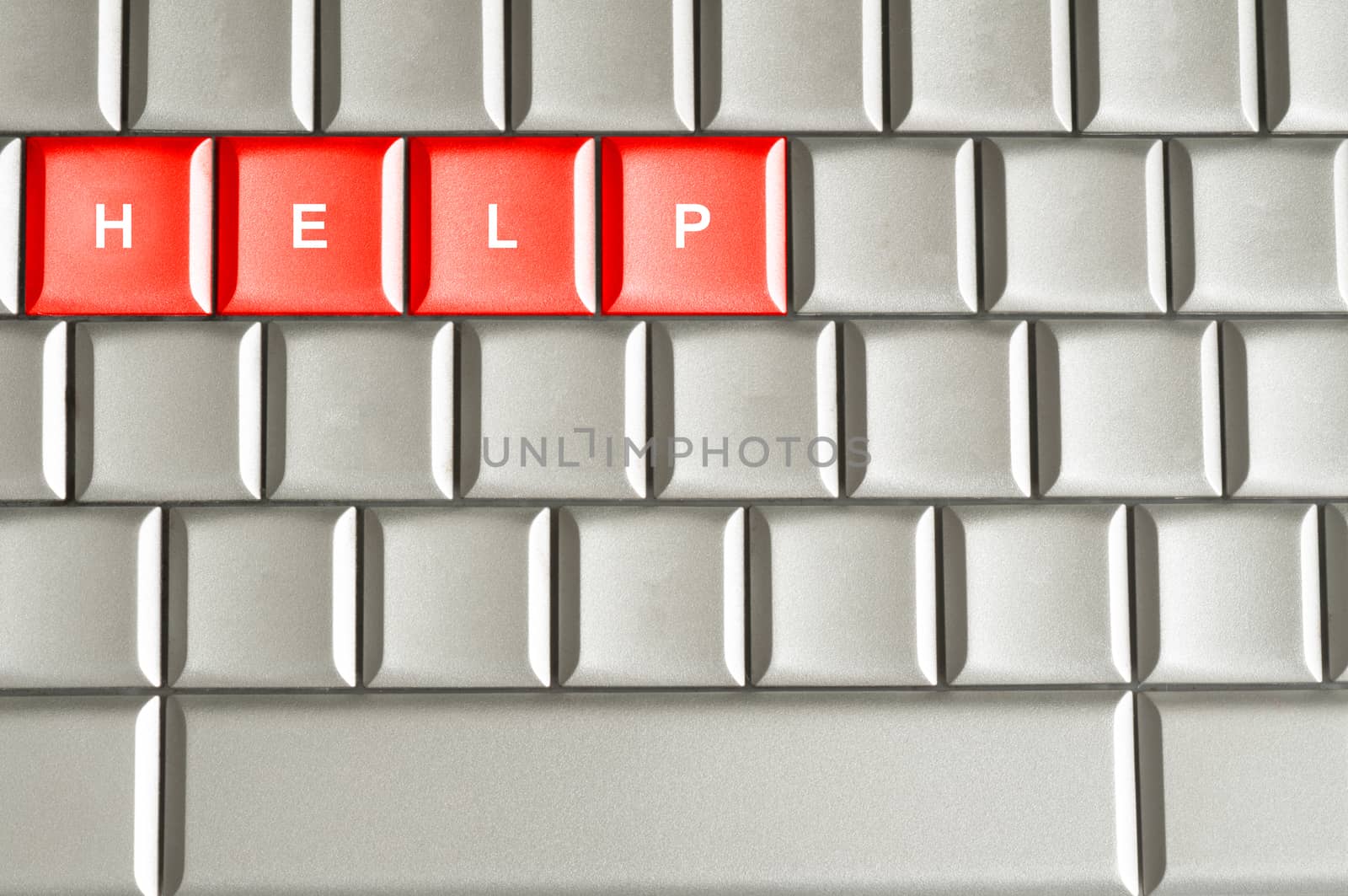 Help word spelled on a metallic keyboard