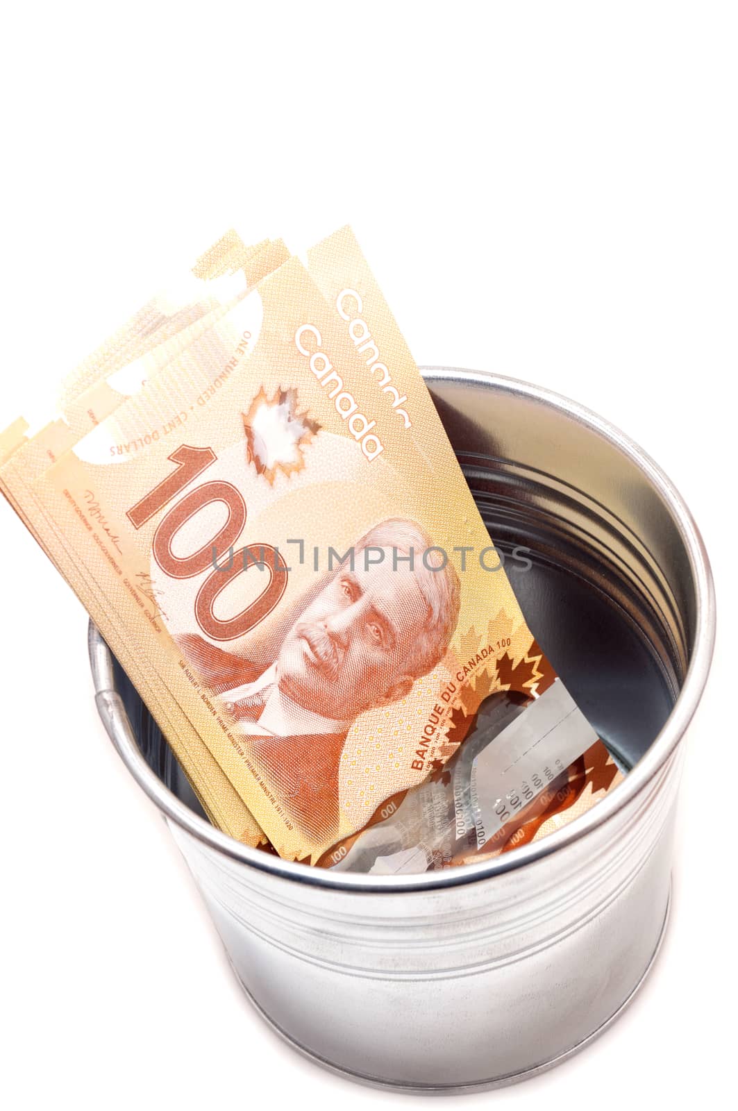 Hundred Canadian dollar bills in a pot by daoleduc