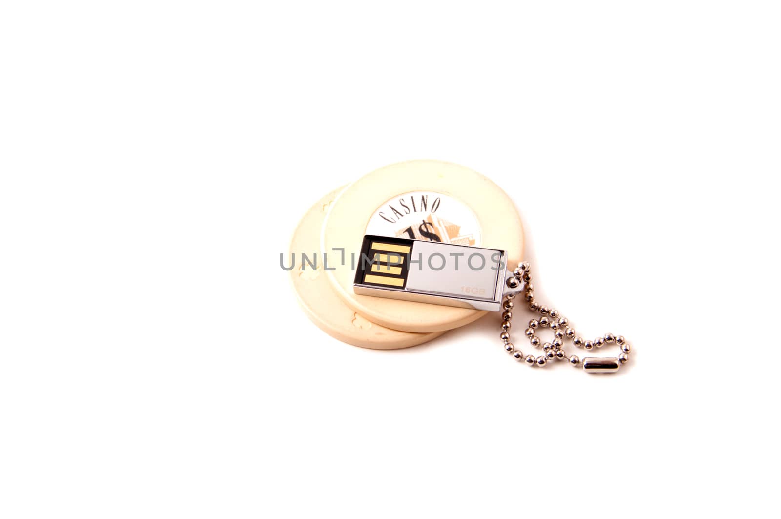 Casino chip with an USB key isolated on white background