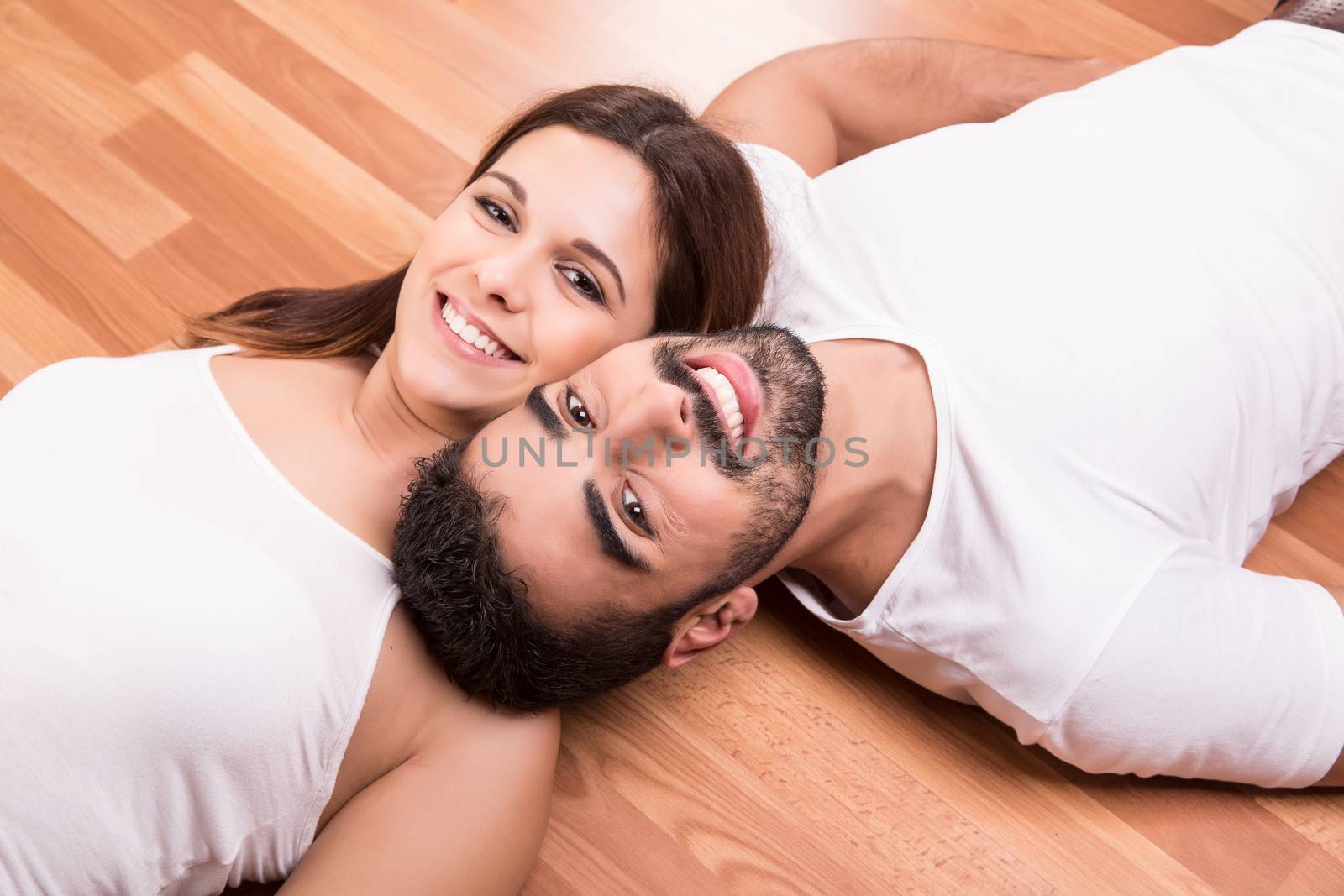 Couple relaxing on the floor by jolopes