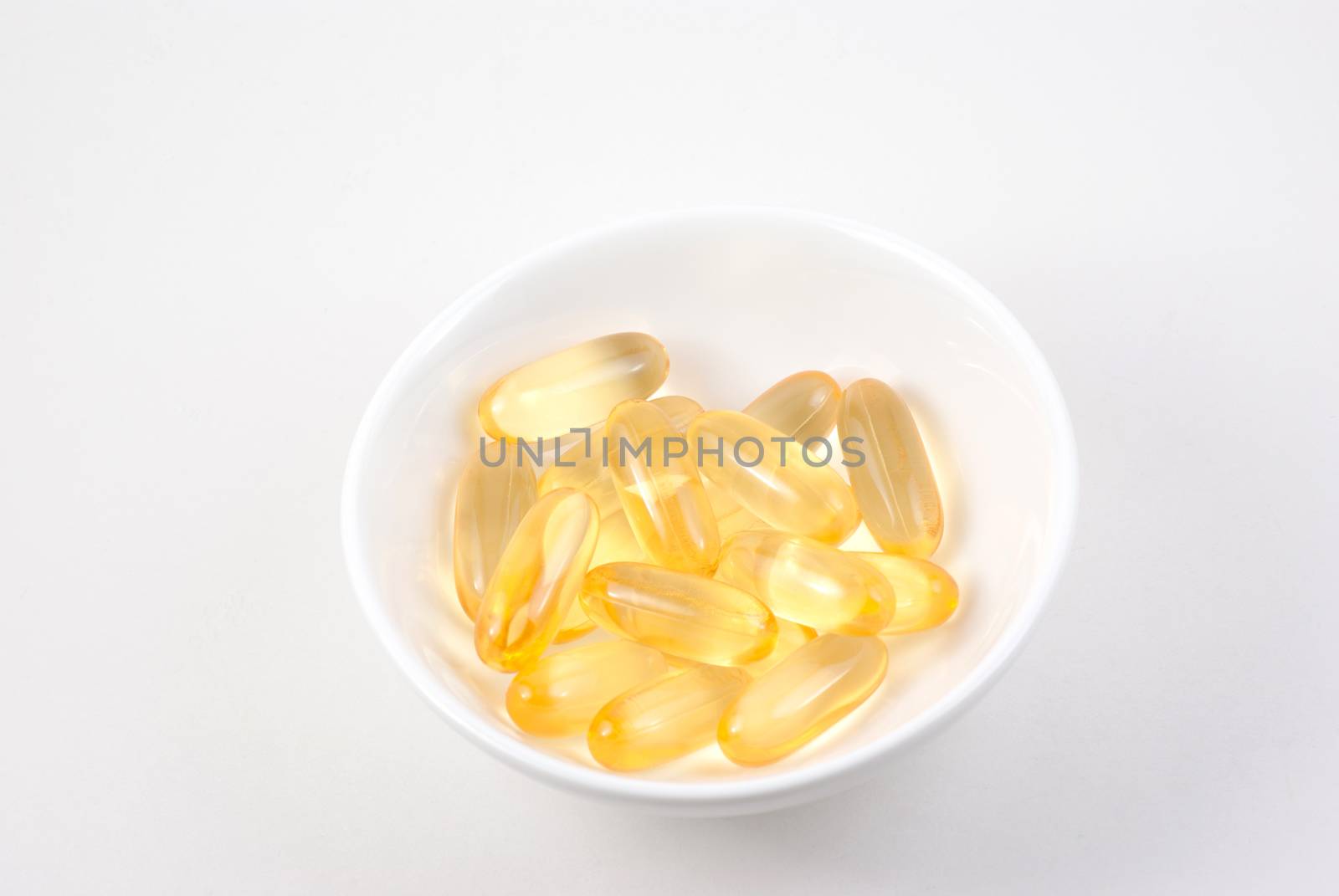 Fish oil capsules in a small dish