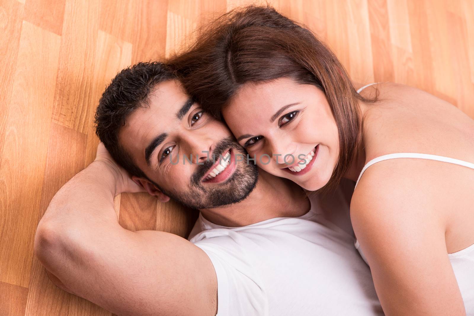 Couple relaxing on the floor by jolopes