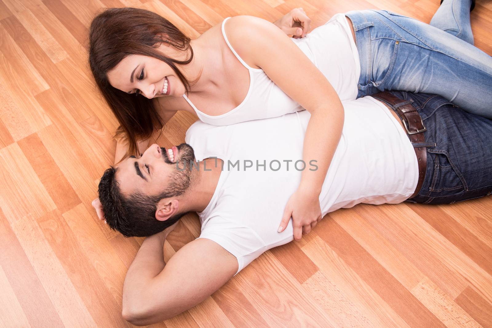 Love Couple at home relaxing on the floor