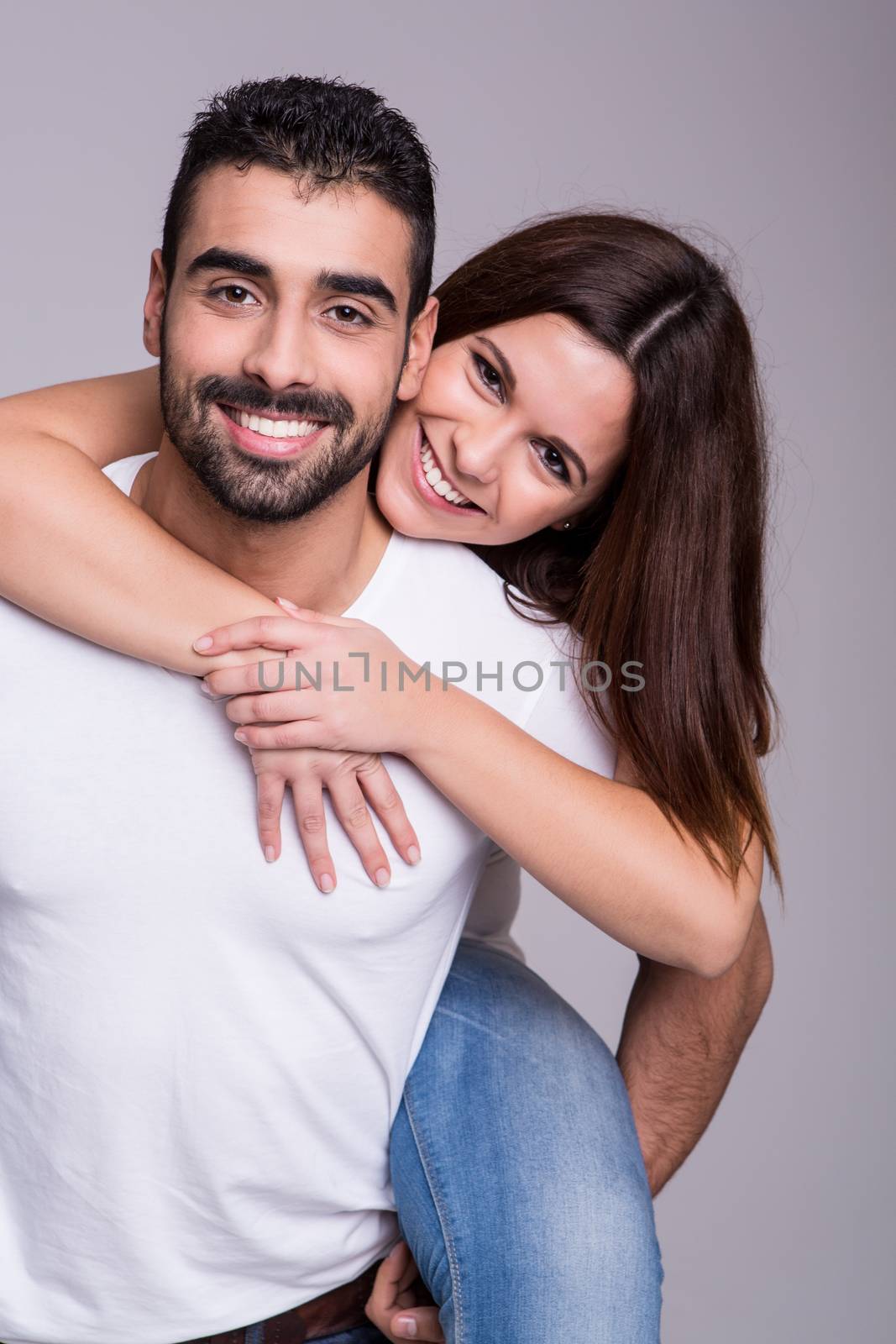 Portrait of a funny love couple hugging each other