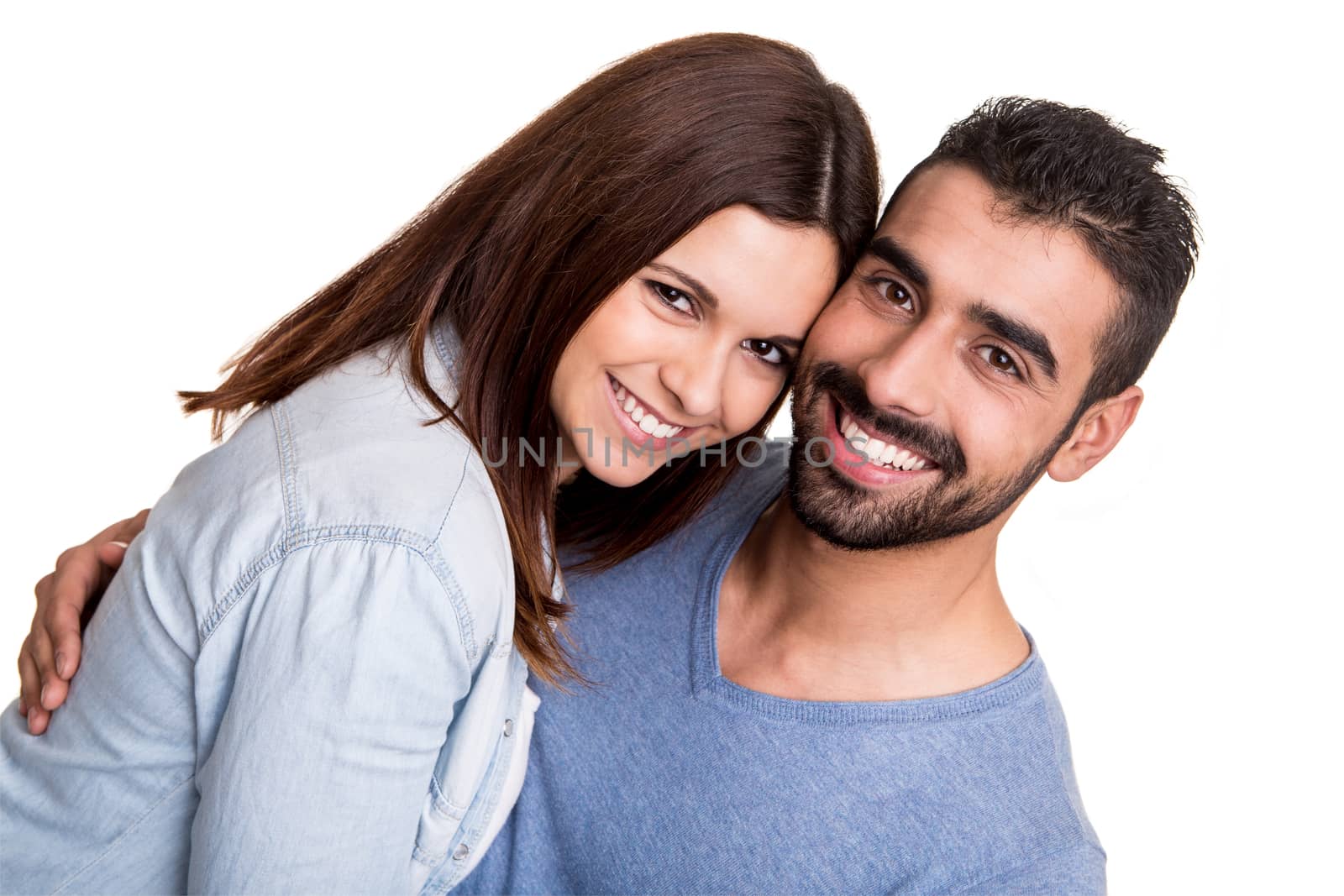 Young love couple hugging over white background