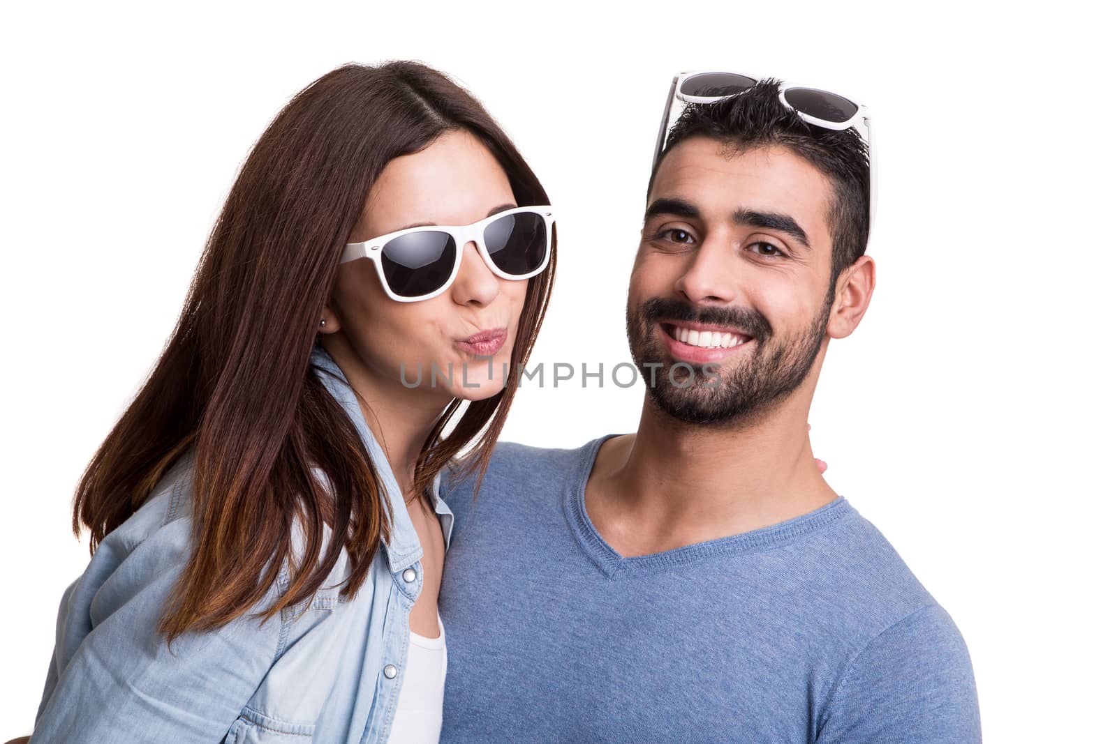 Portrait of a funny couple wearing sunglasses 