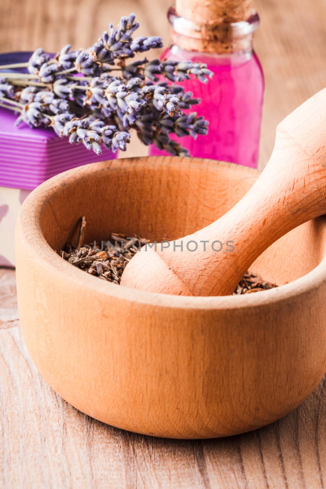 Dry lavender bunch and wooden mortar, preparation