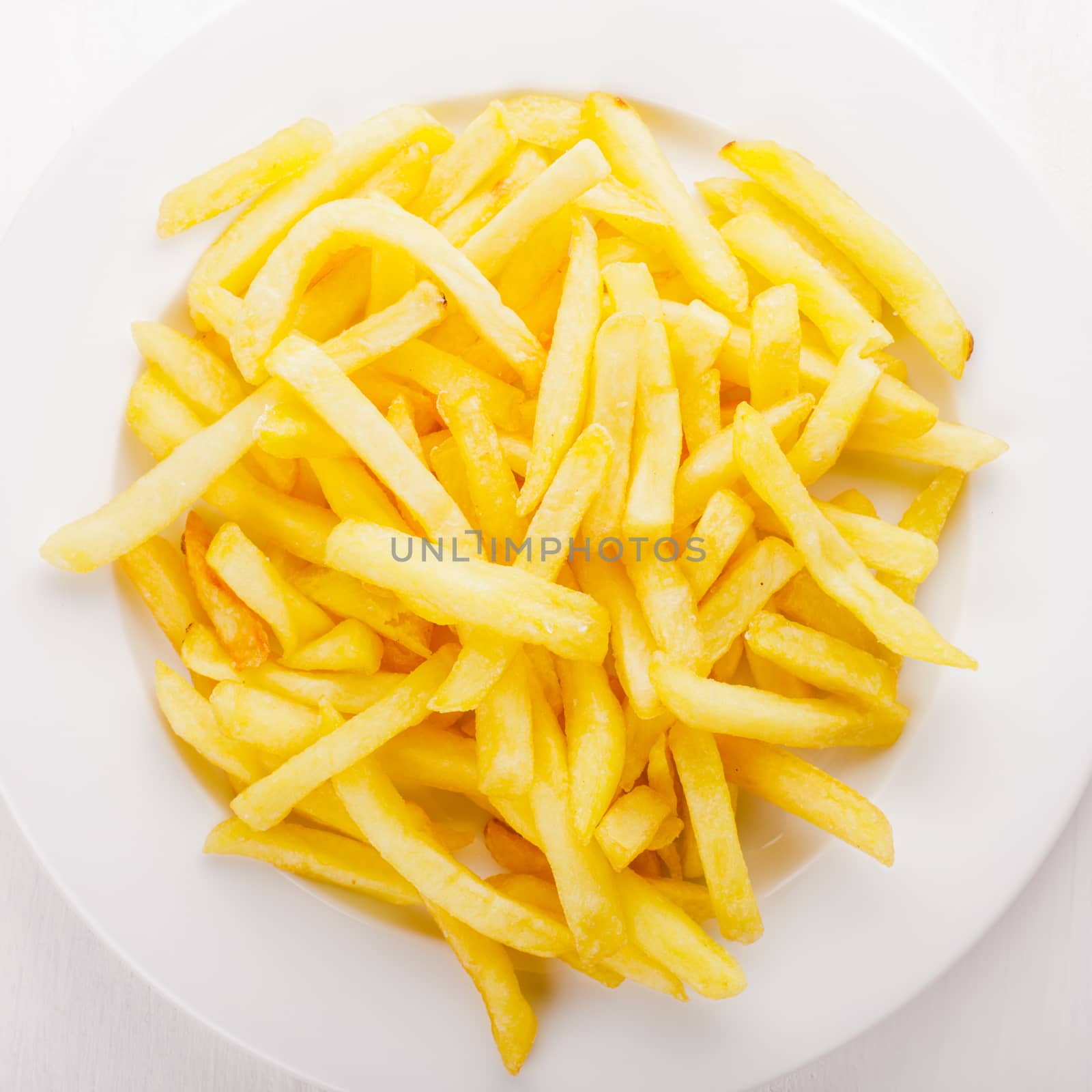 Fried potato on a white plate on the table