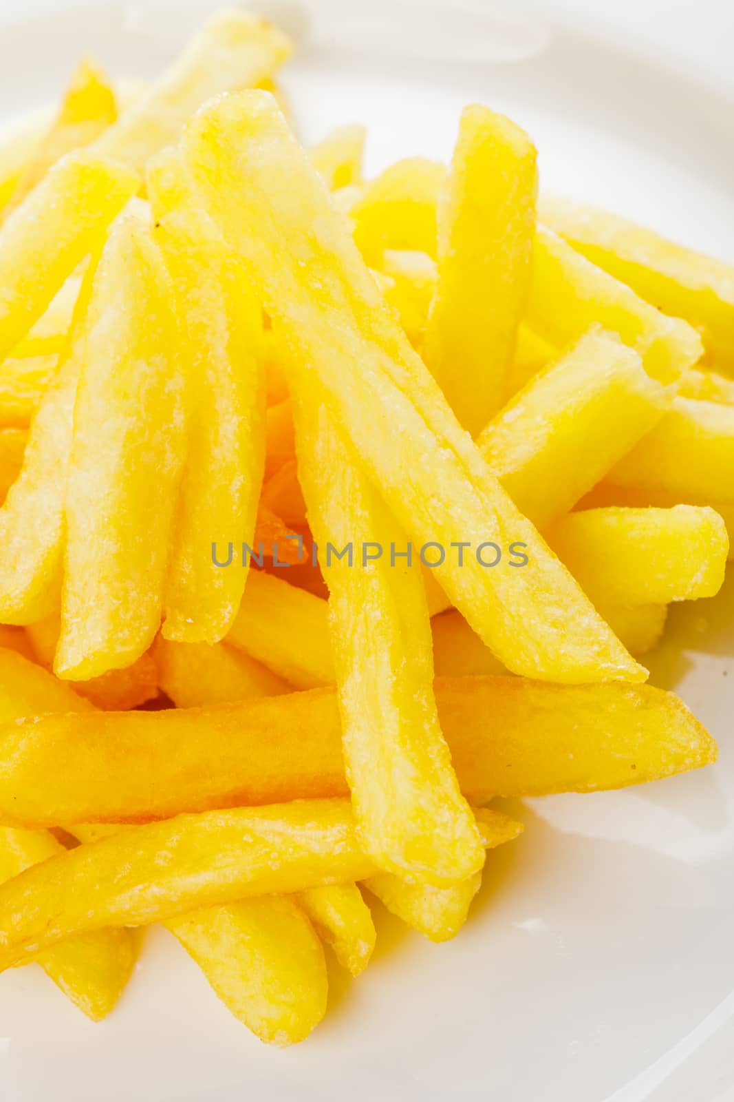 Fried potato on a white plate on the table