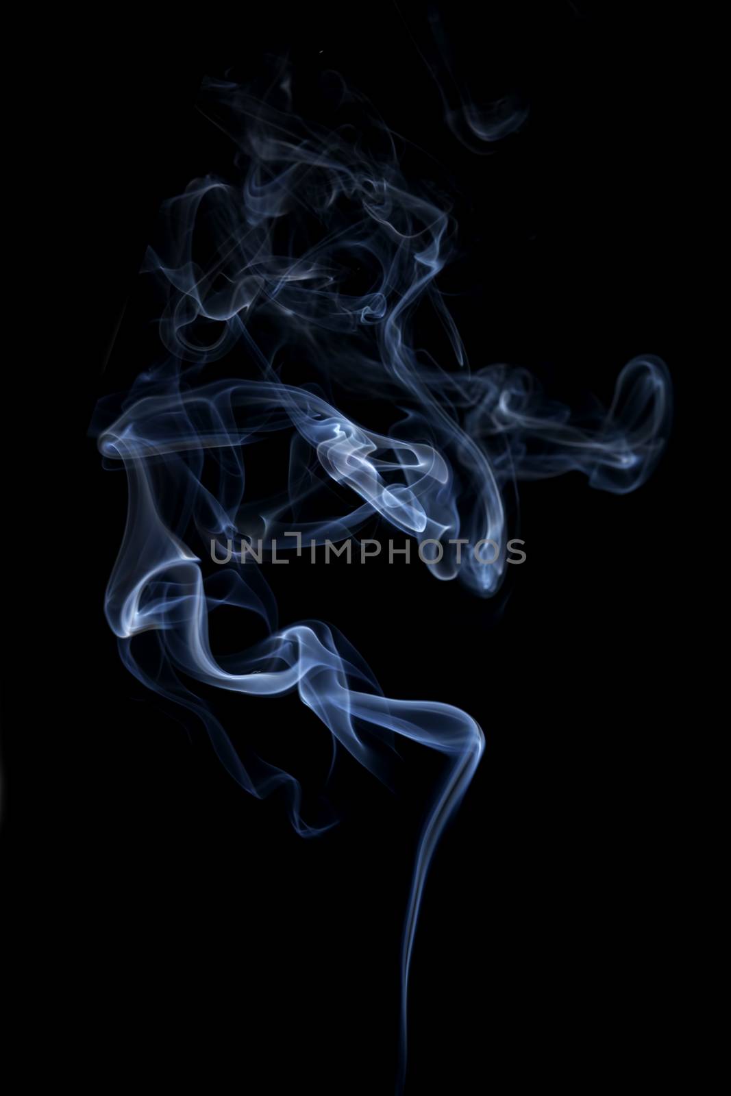 Blue smoke isolated on black background. Abstract background.