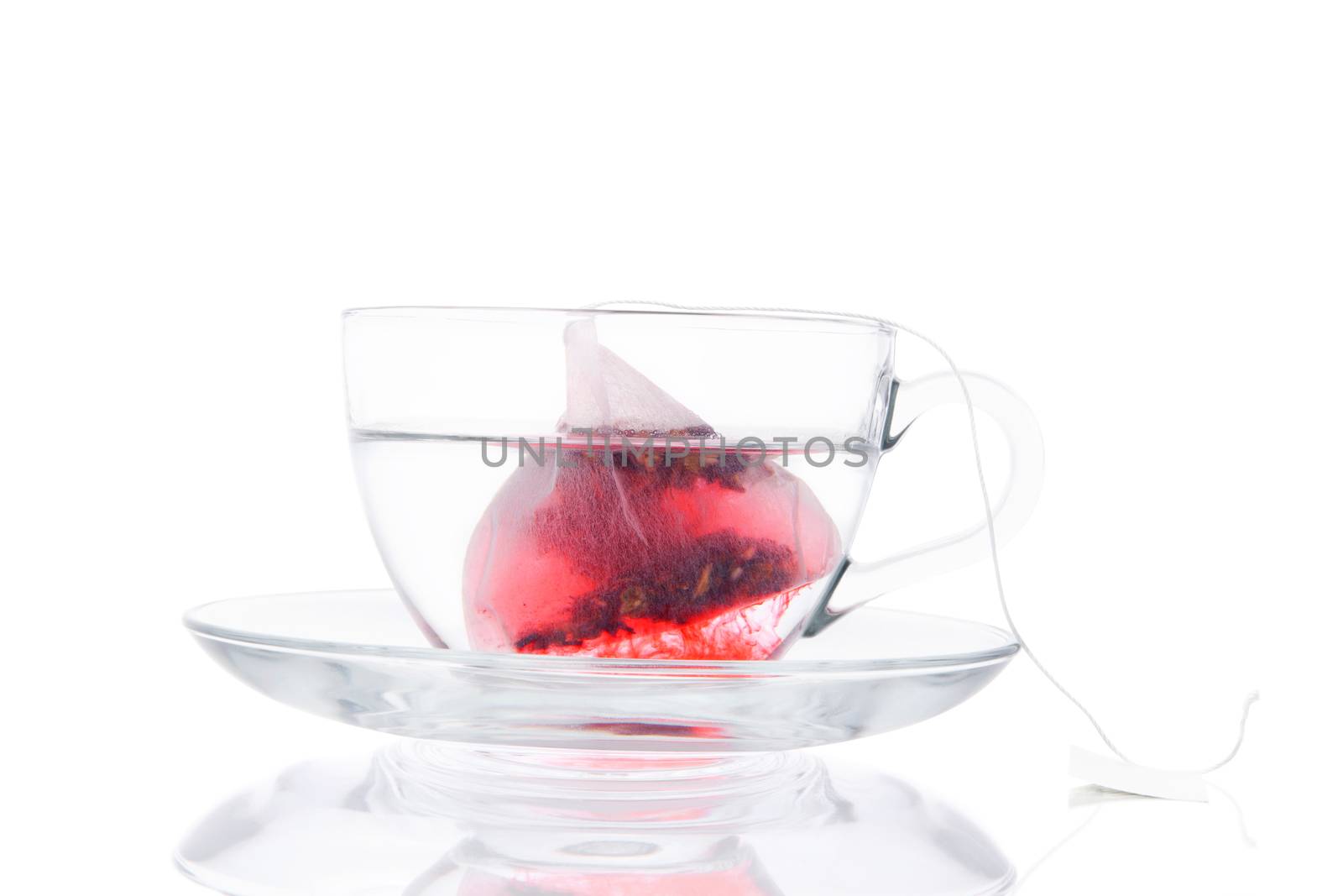 Tea Bag In The Transparent Cup With Hot Water. by eskymaks
