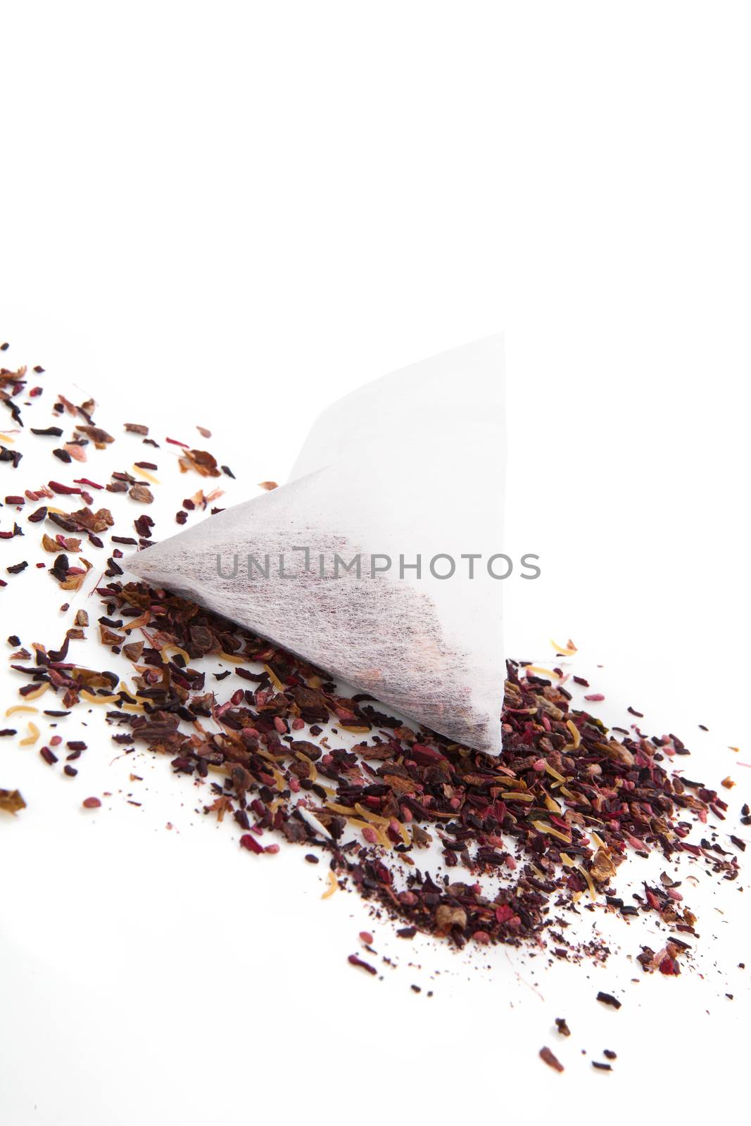 Tea bag and tea crop isolated on white background. Culinary delicious tea drinking concept.