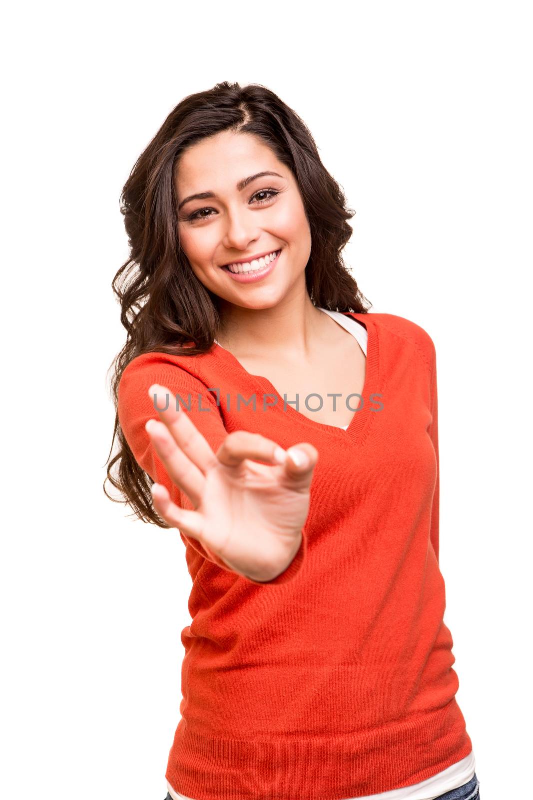 Beautiful young woman showing Ok sign