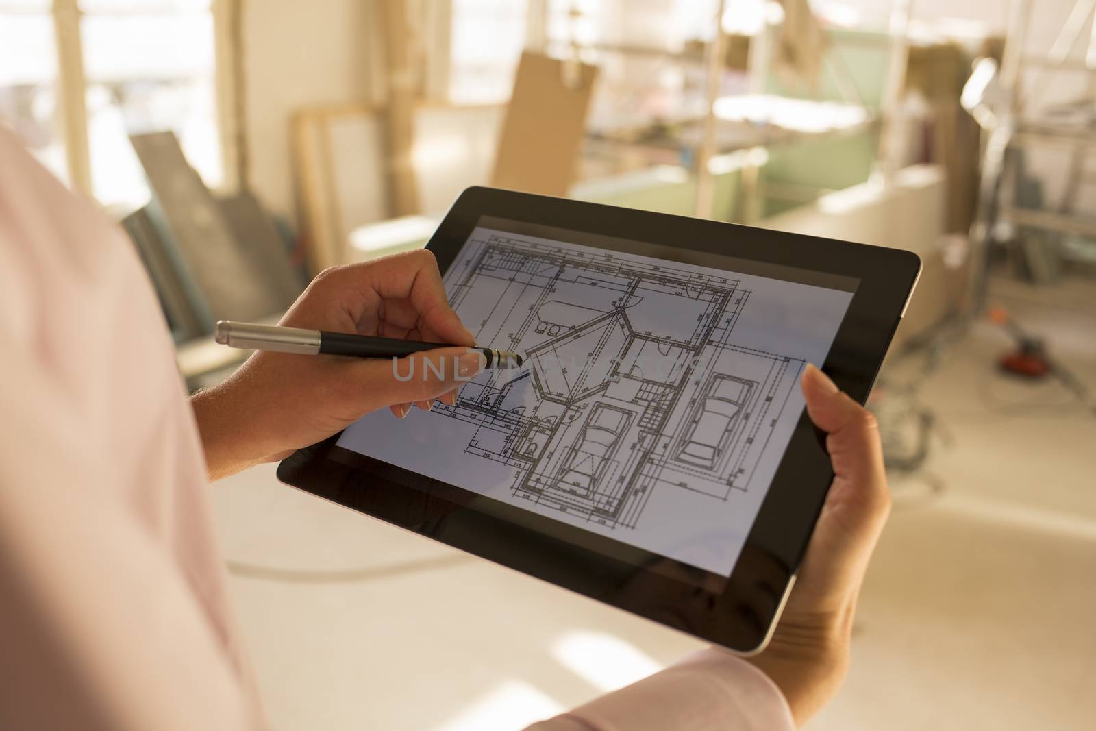 Architect woman working with electronic tablet by LDProd