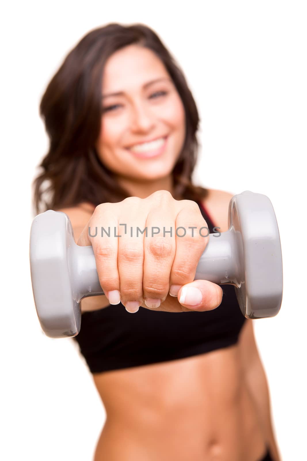 Beautiful fitness woman lifting weights