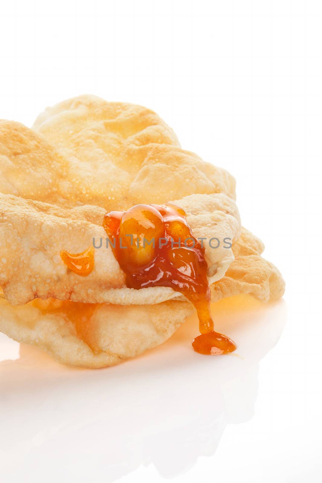 Delicious papadum with mango chutney isolated on white background. Culinary indian eating.