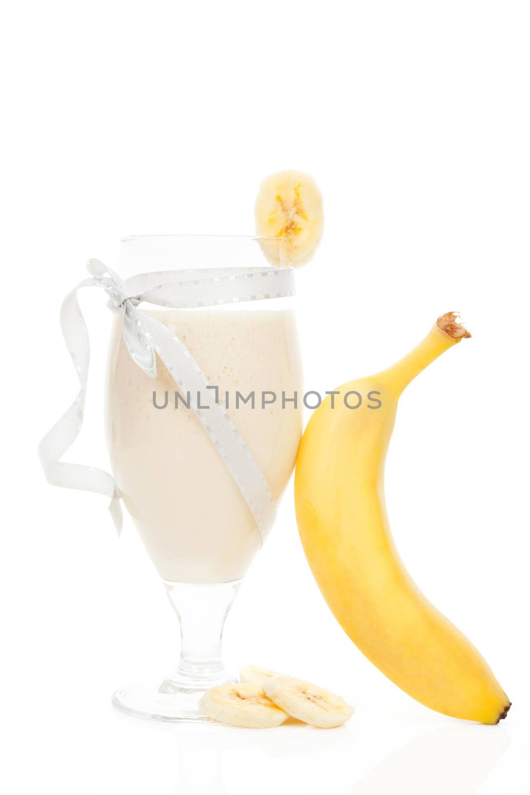 Delicious banana shake with fresh banana isolated on white background. Fresh summer drink.
