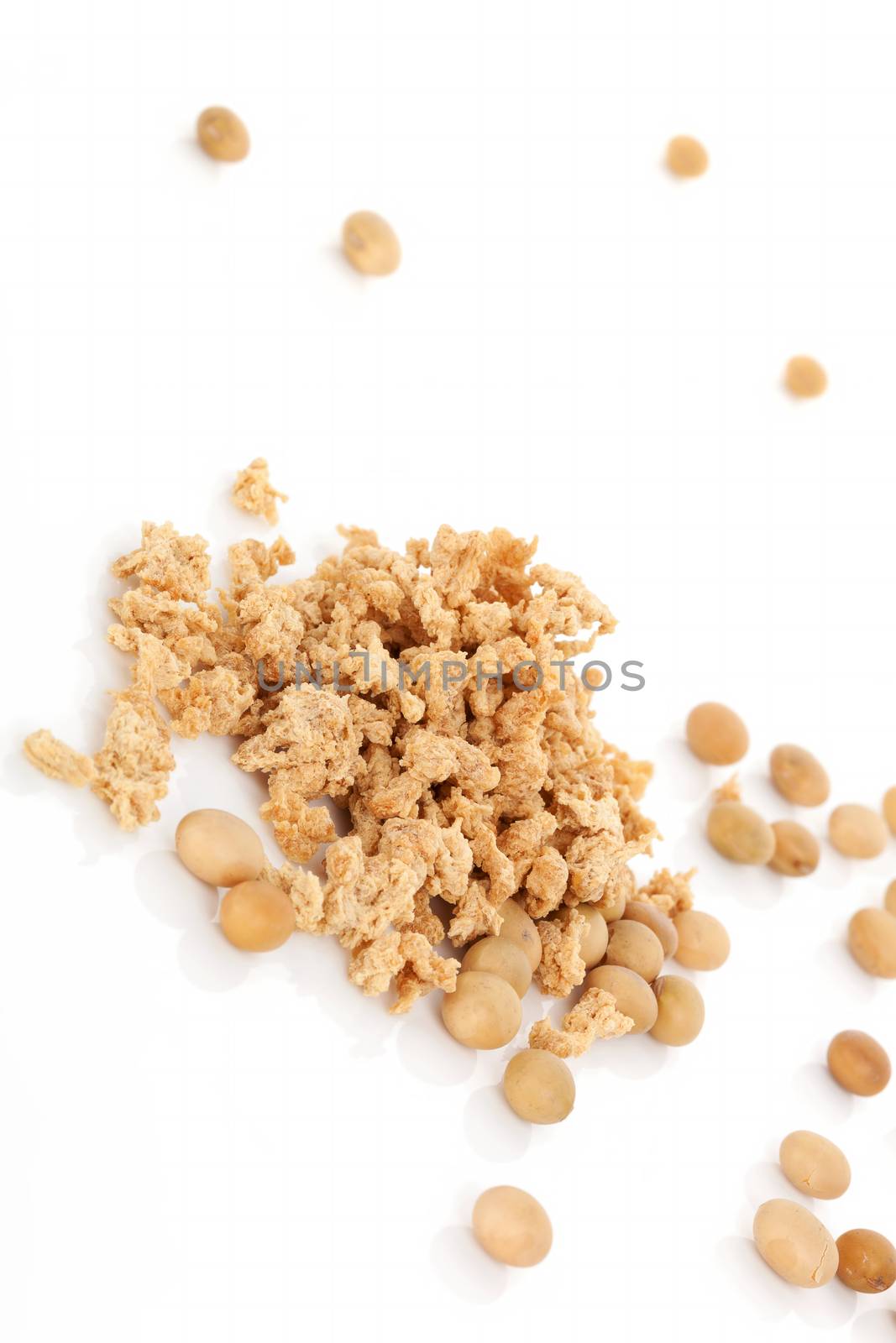Soybeans and granules isolated on white background. Vegetarian and vegan eating concept.