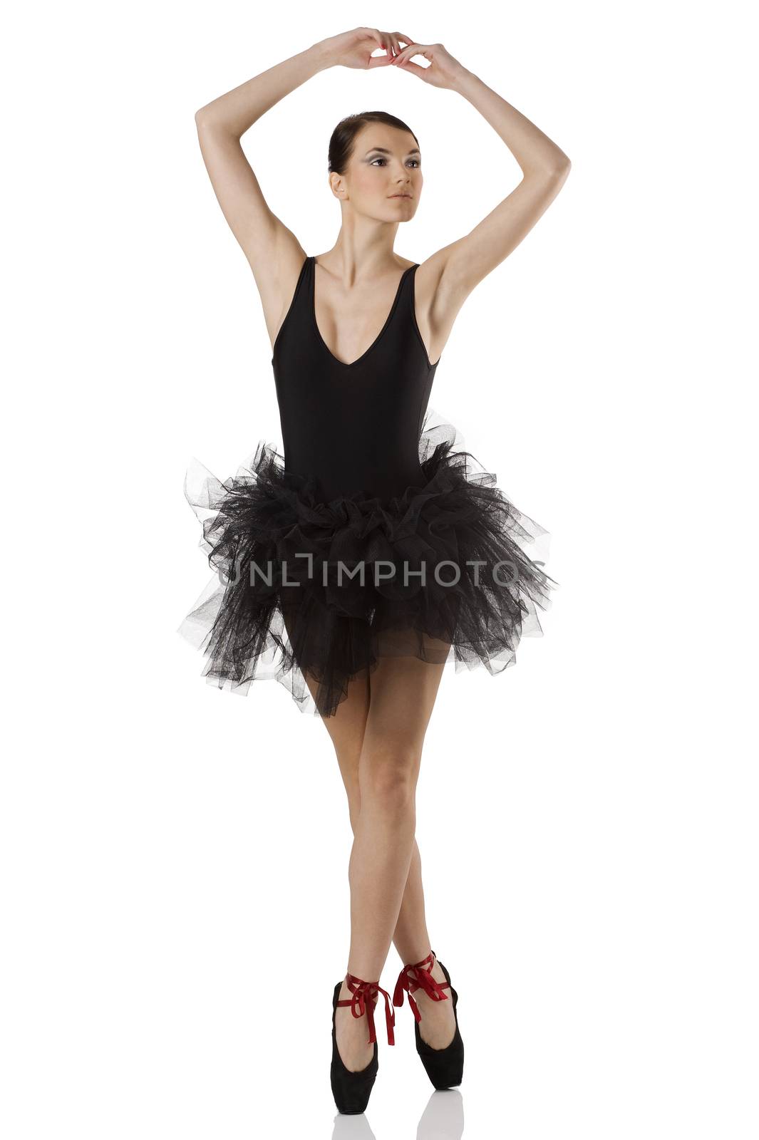 classic dancer with black dress and shoes on white background dancing on pointe