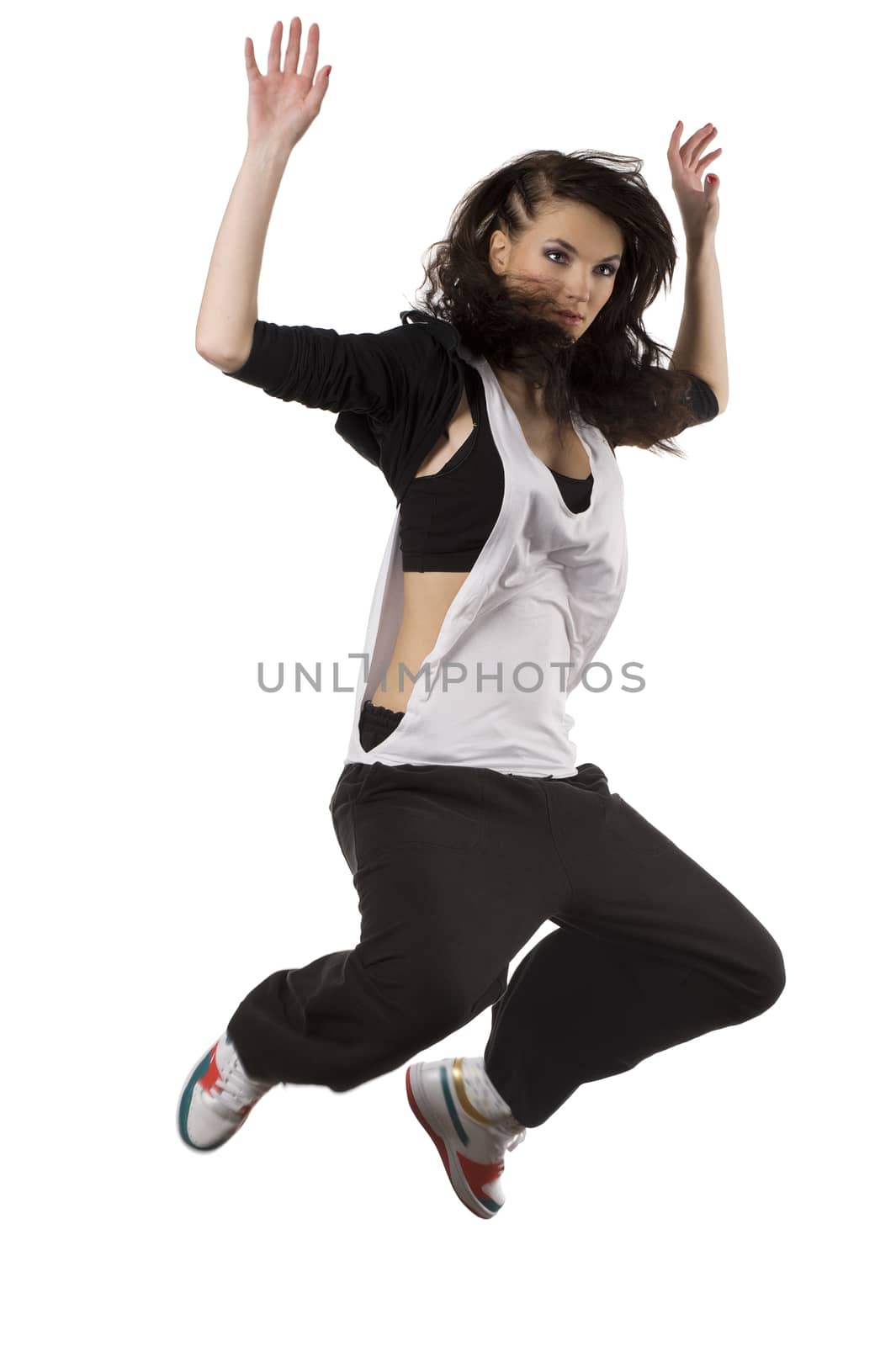 modern young woman dancer in hip hop style jumping over white background