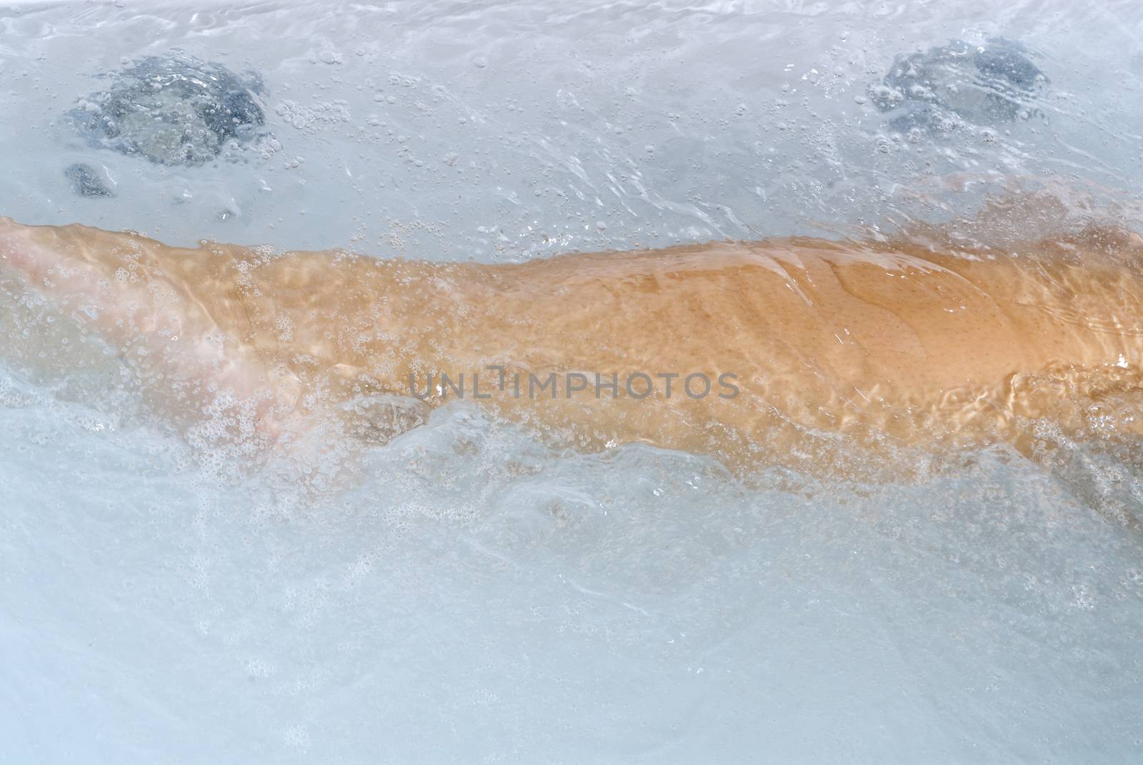 close up of woman body inside a whirlpool