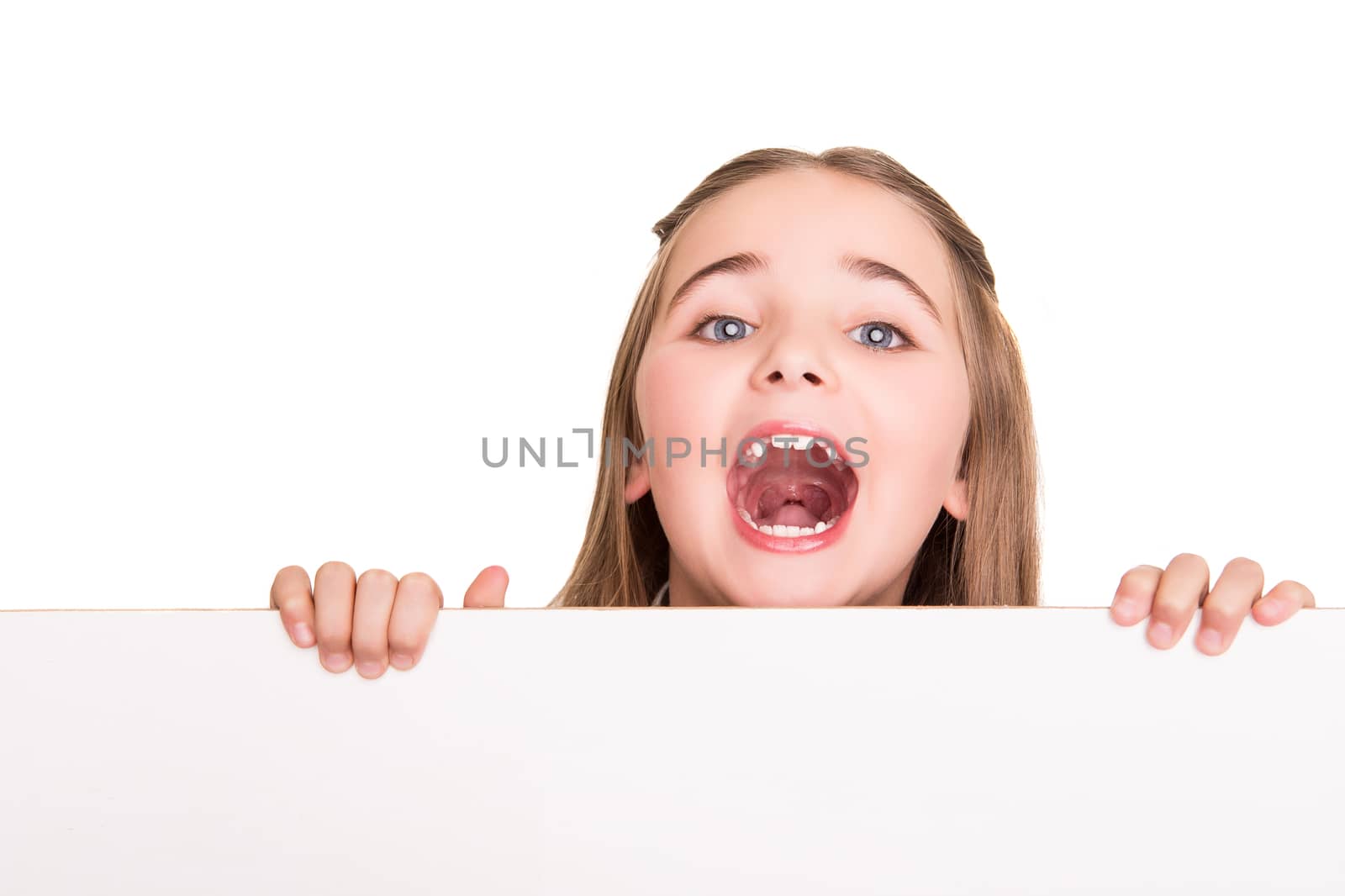 Cute little girl behind a white board