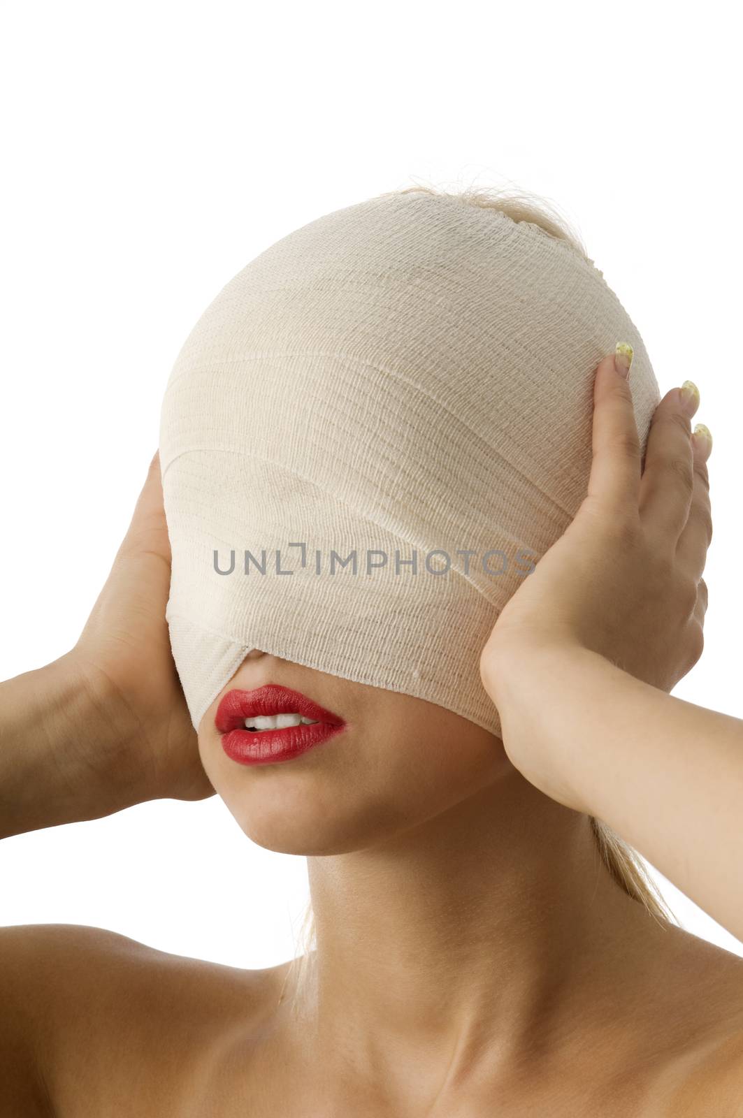 portrait of woman with bandage with hands against ears
