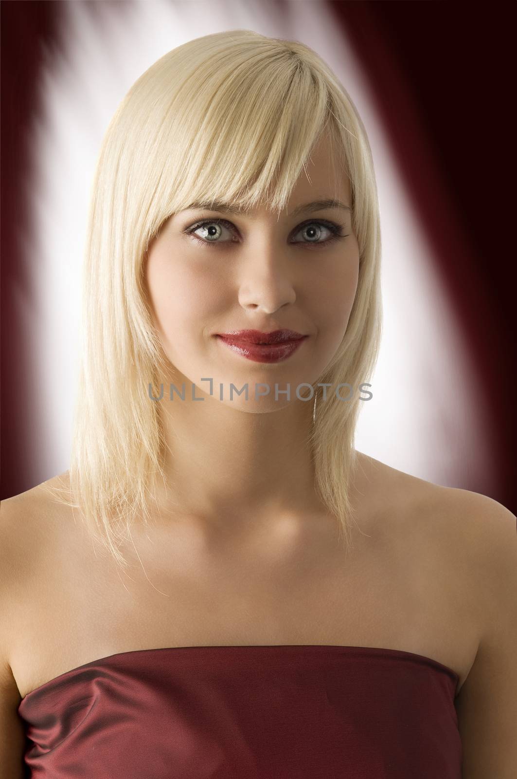 fashion portrait of blond girl with rich purple make up color