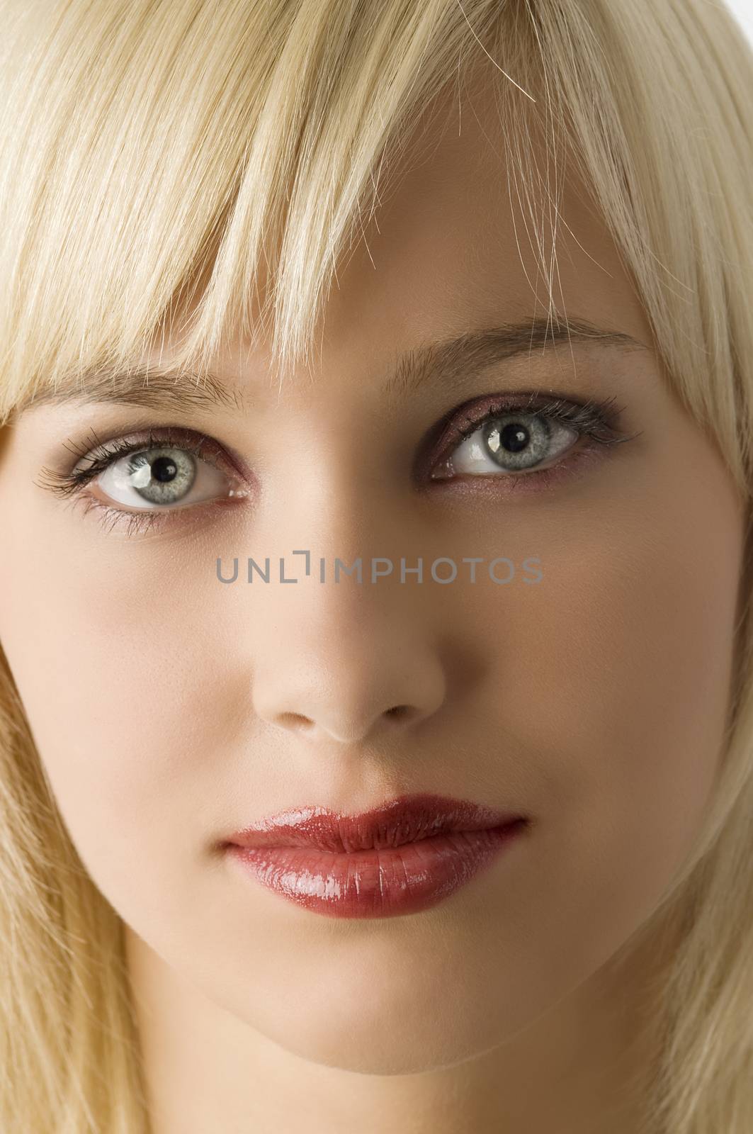 close up of blond girl with rich purple make up color