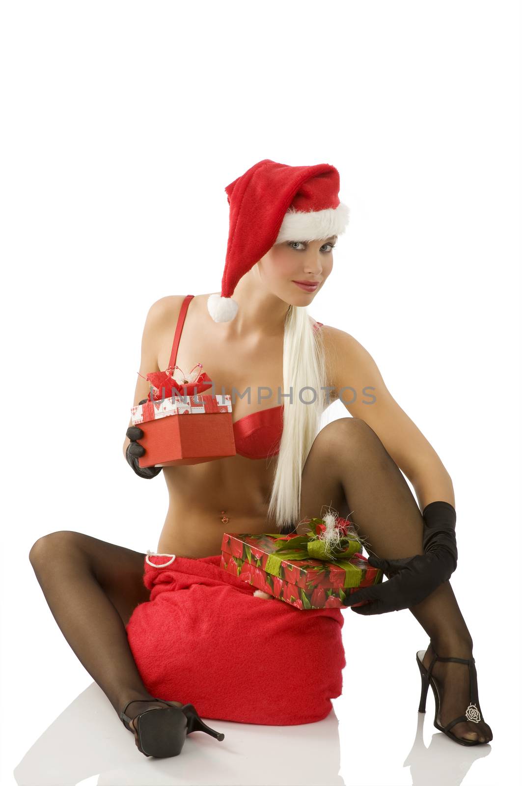 beautiful blond santa claus with sack full of present sitting down