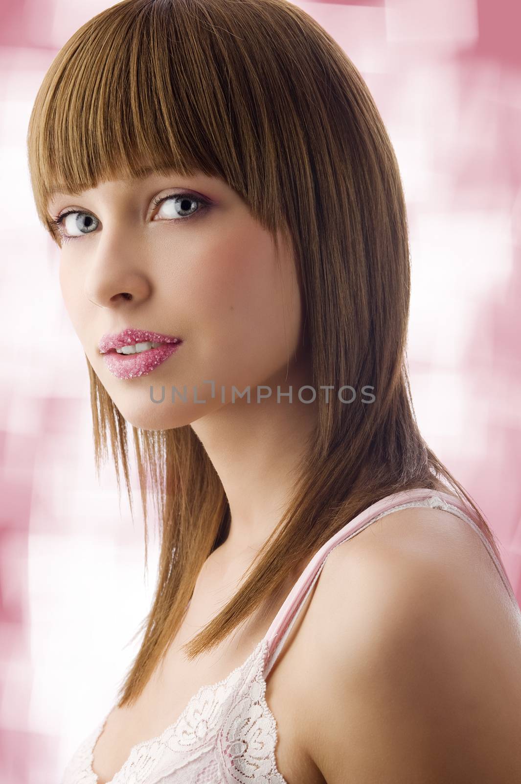 beauty portrait of young cute brunette with pink lips with sugar