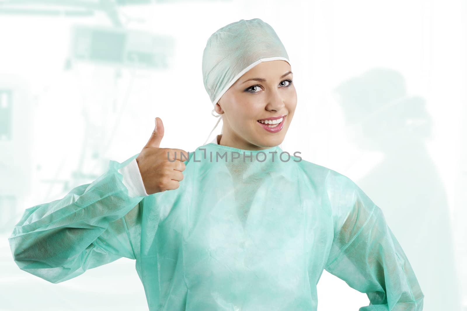 smiling a positive young beauty nurse in green operation dress with surgery cap