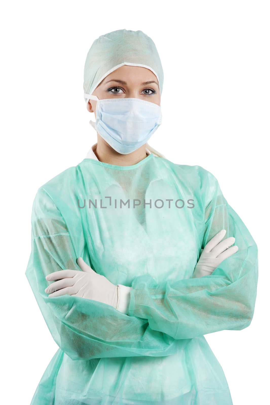 young beauty nurse in green operation dress with surgery cap and mask posing