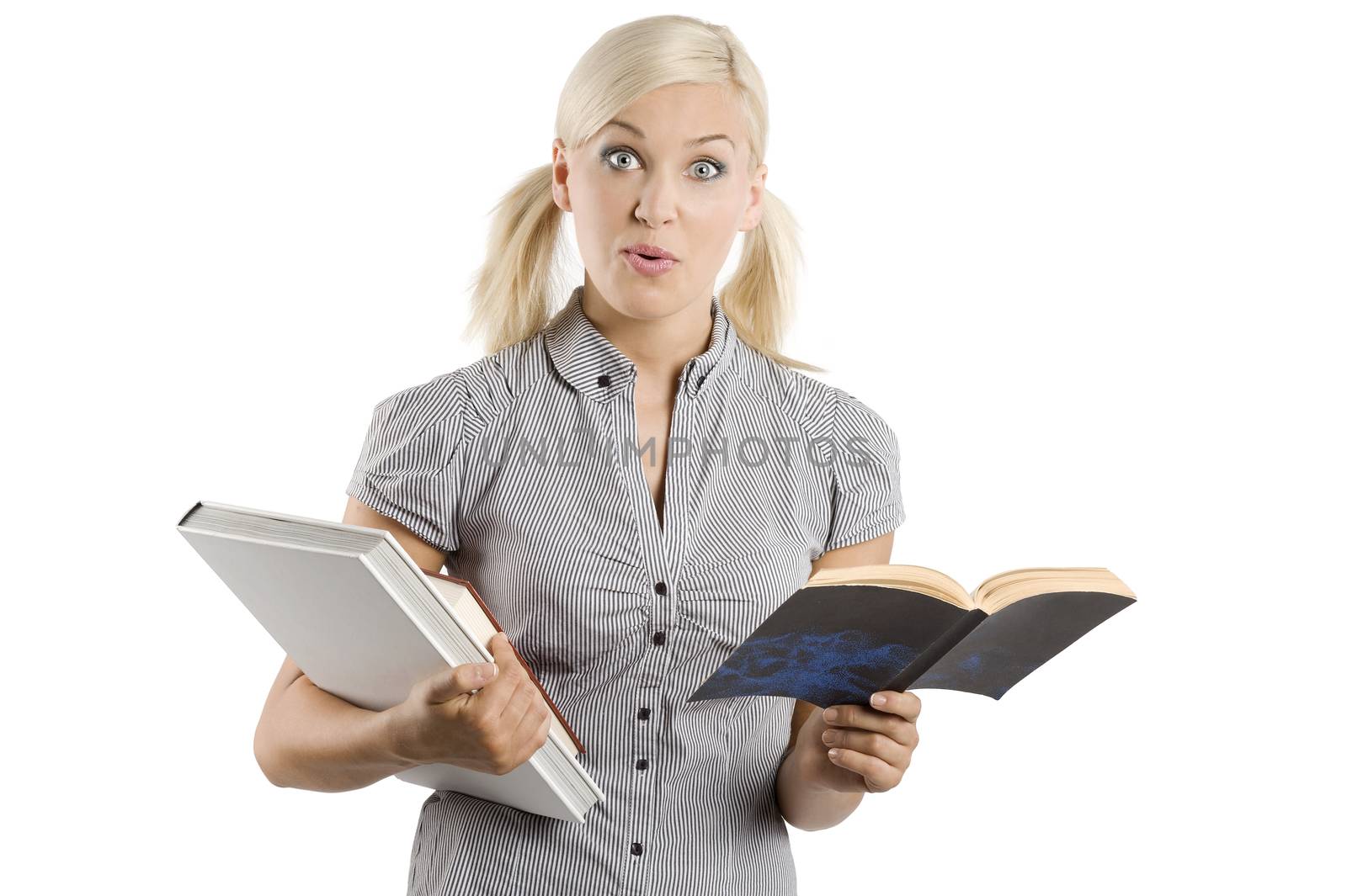 graceful young woman student in casual dress keeping some books and making funny face