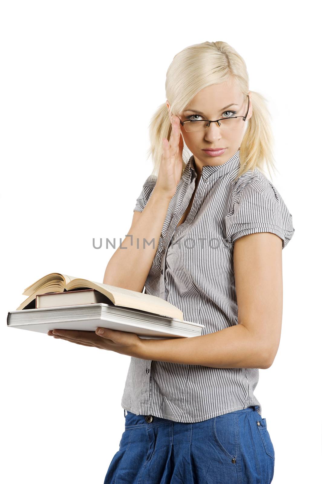 young teacher with glasses and books looking in camera with sexy expression