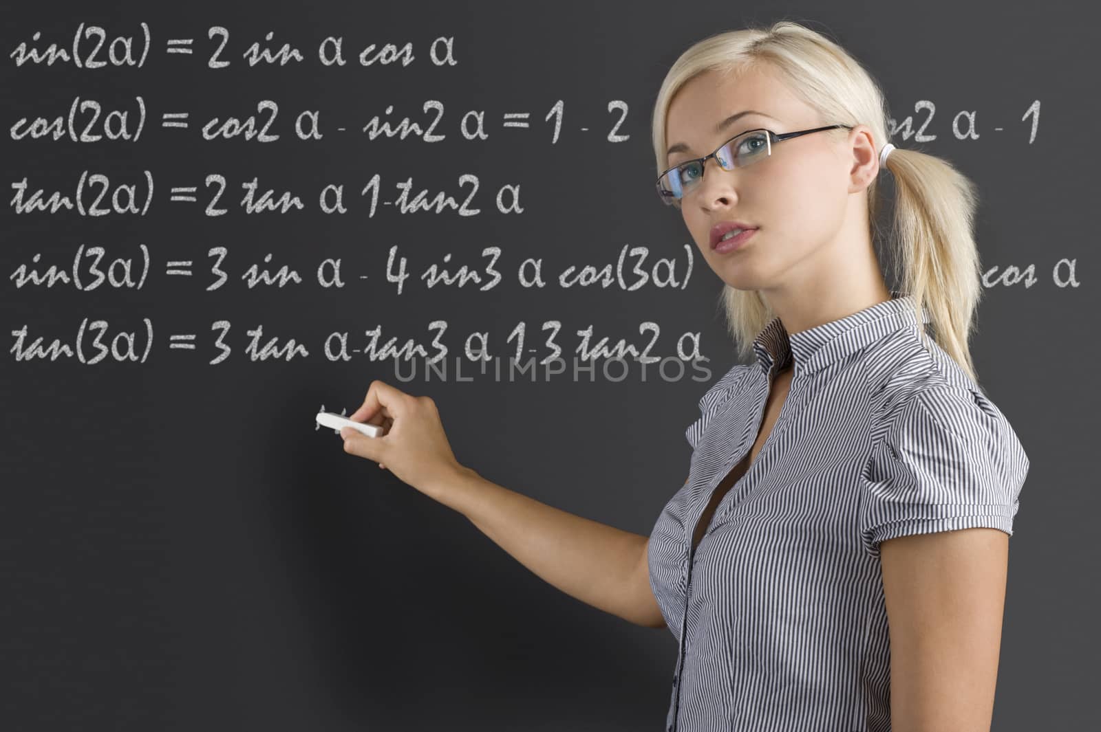 teacher young woman at blackboard by fotoCD