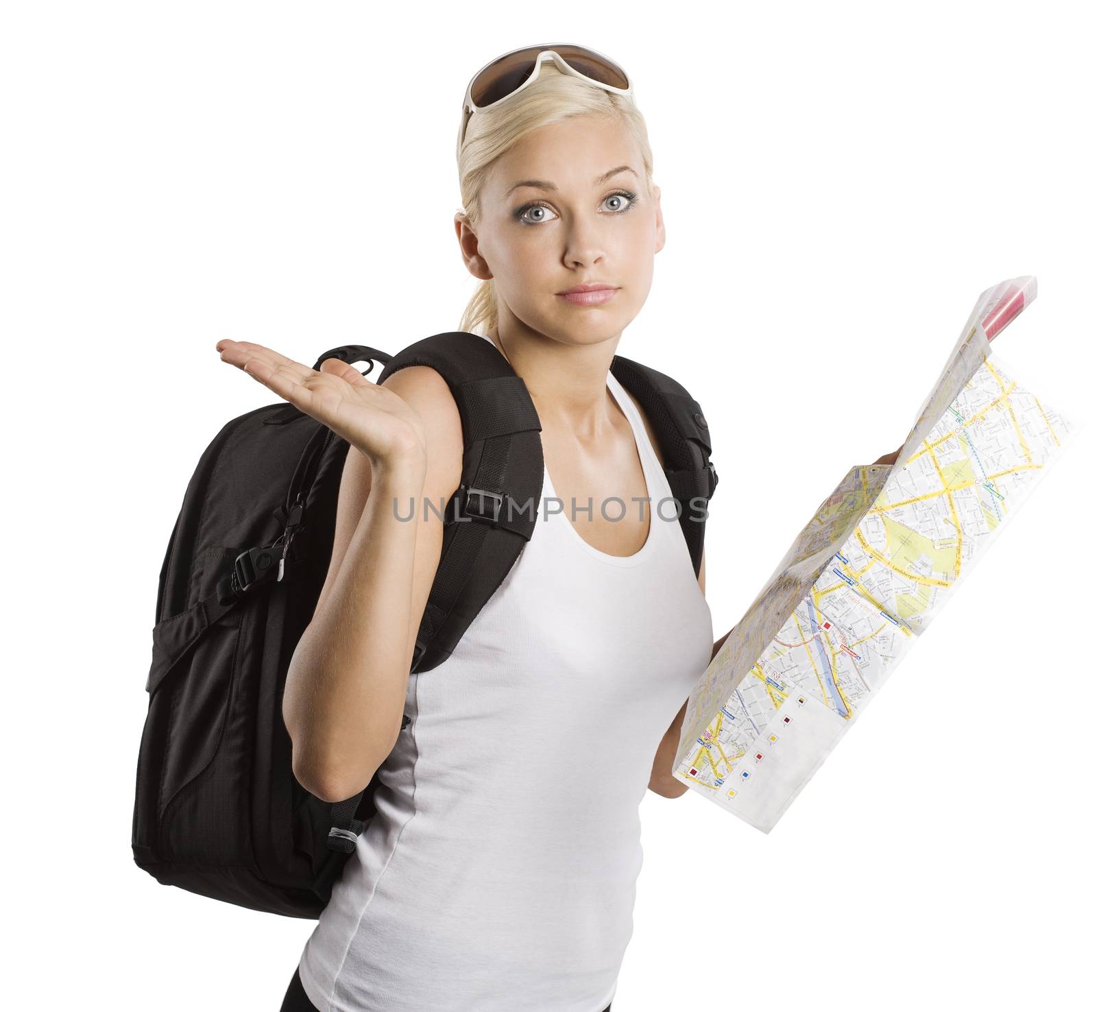 young pretty girl in vacation with map and rucksack looking in camera with funny expression