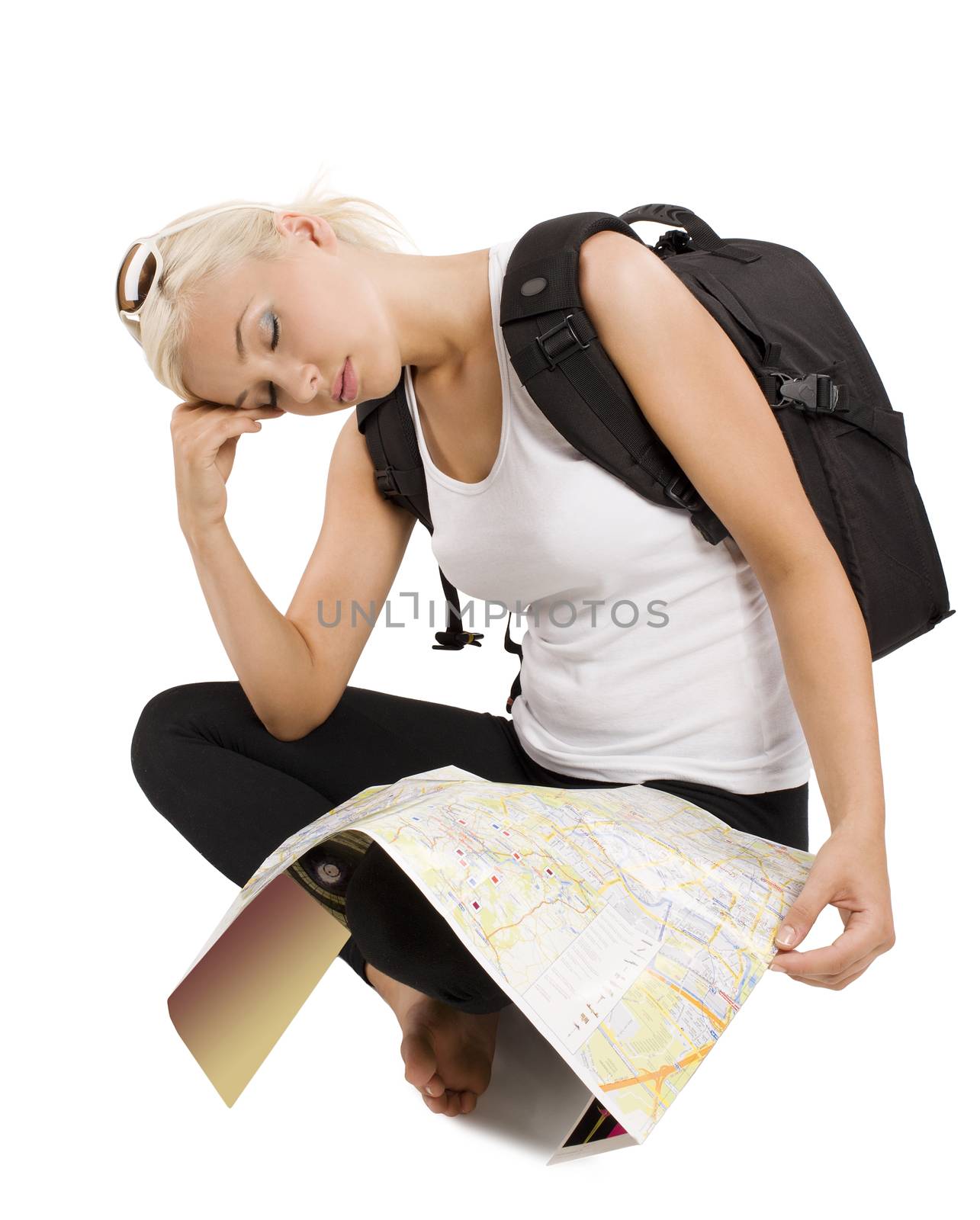 blond young tourist with map sitting down and sleeping