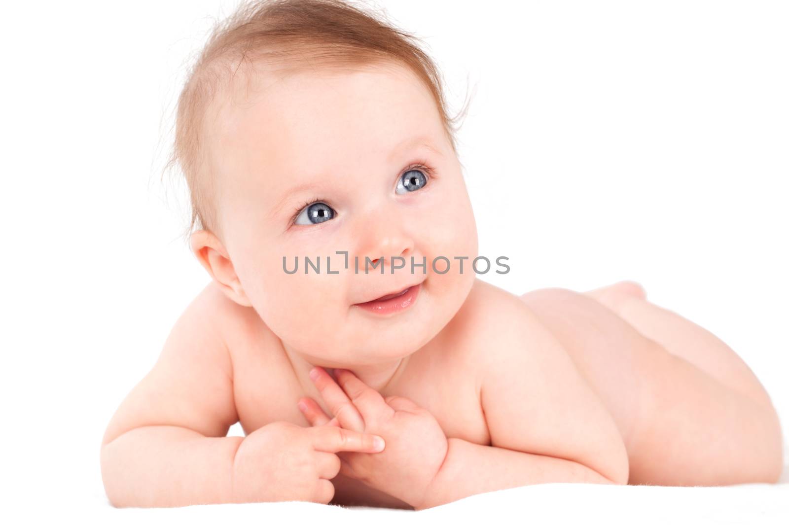 Cute naked caucasian baby lying isolated on white background. 
