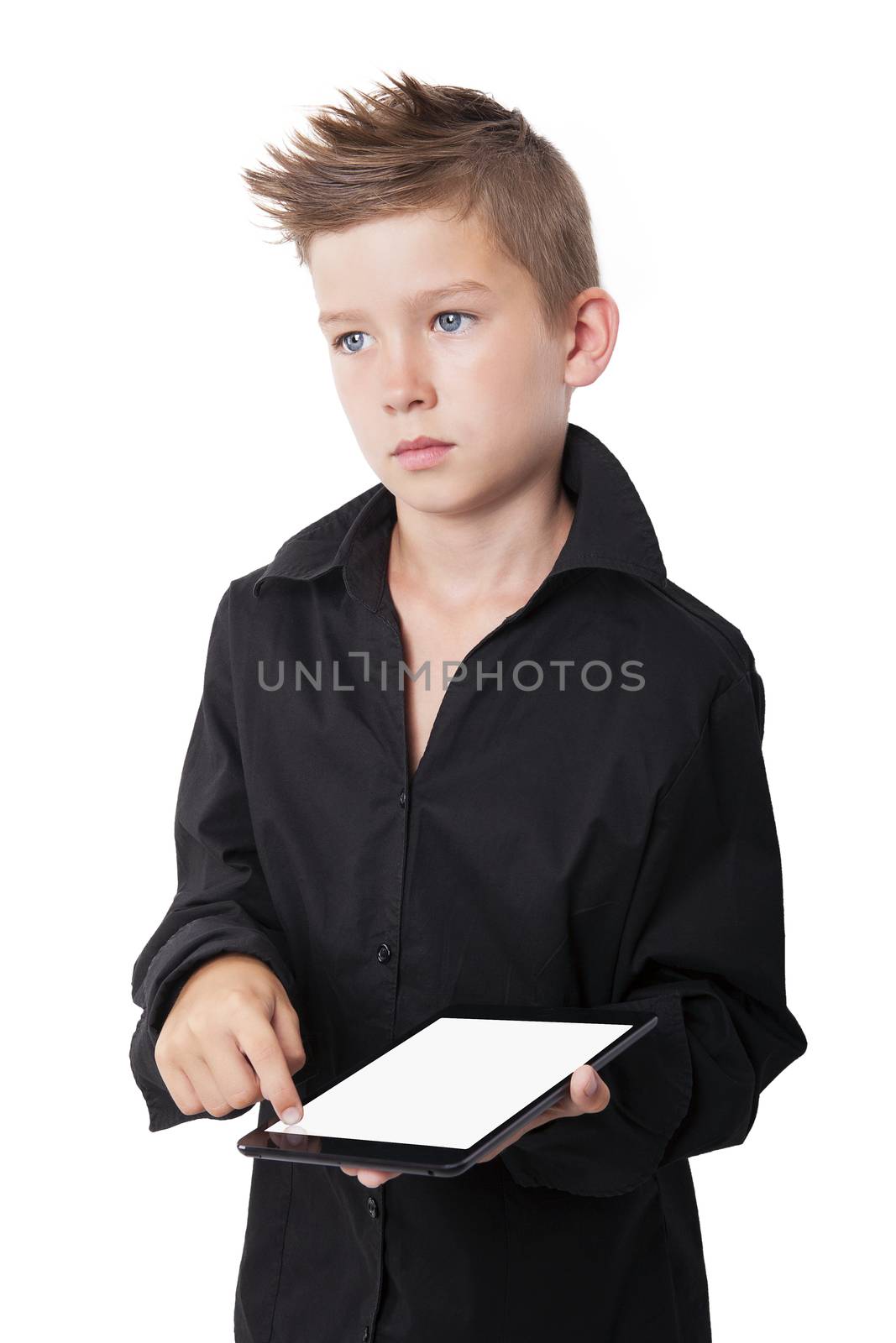 Charming boy holding and touching tablet screen with finger isolated on white background.